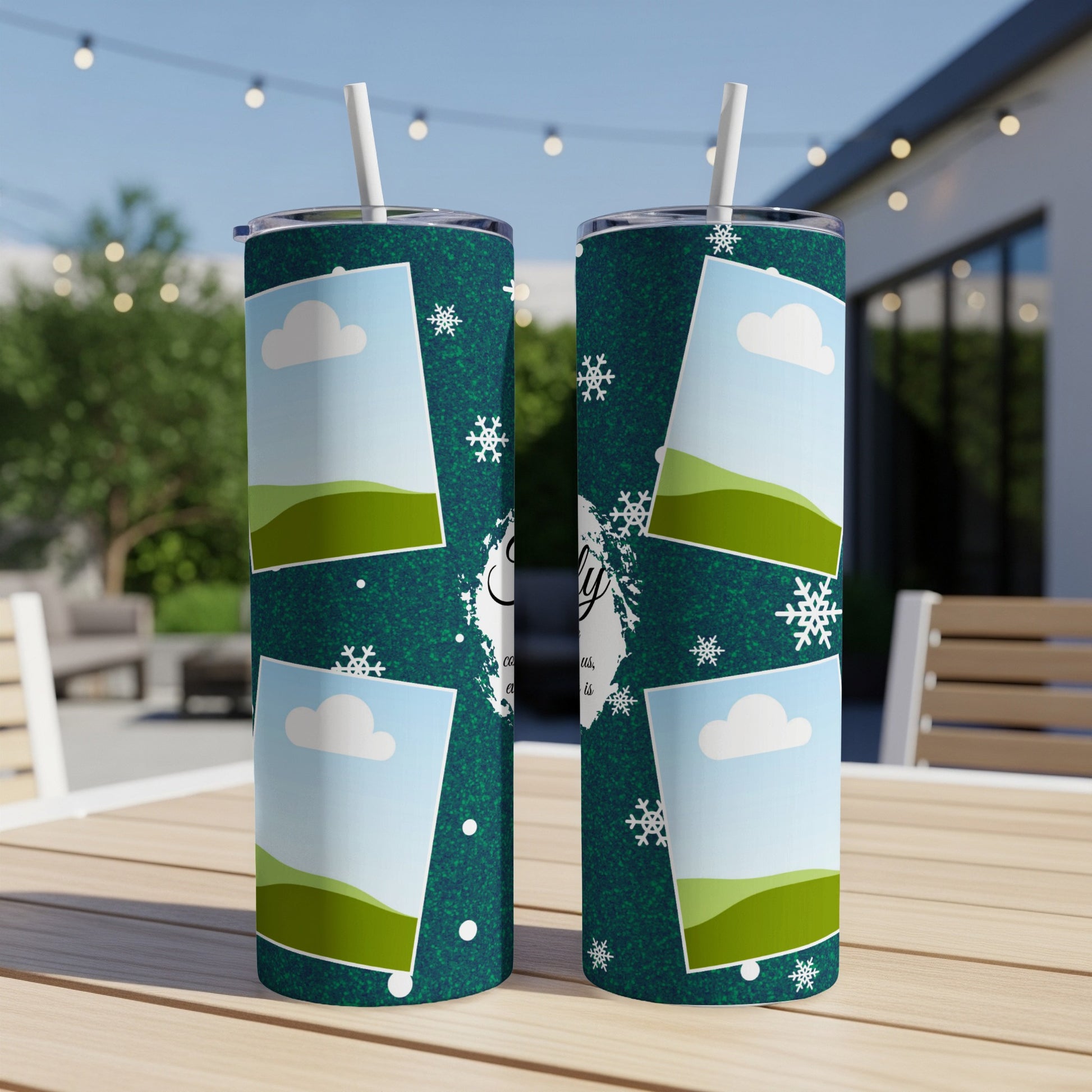 Two dark green tumblers with a winter scene and photo frames.