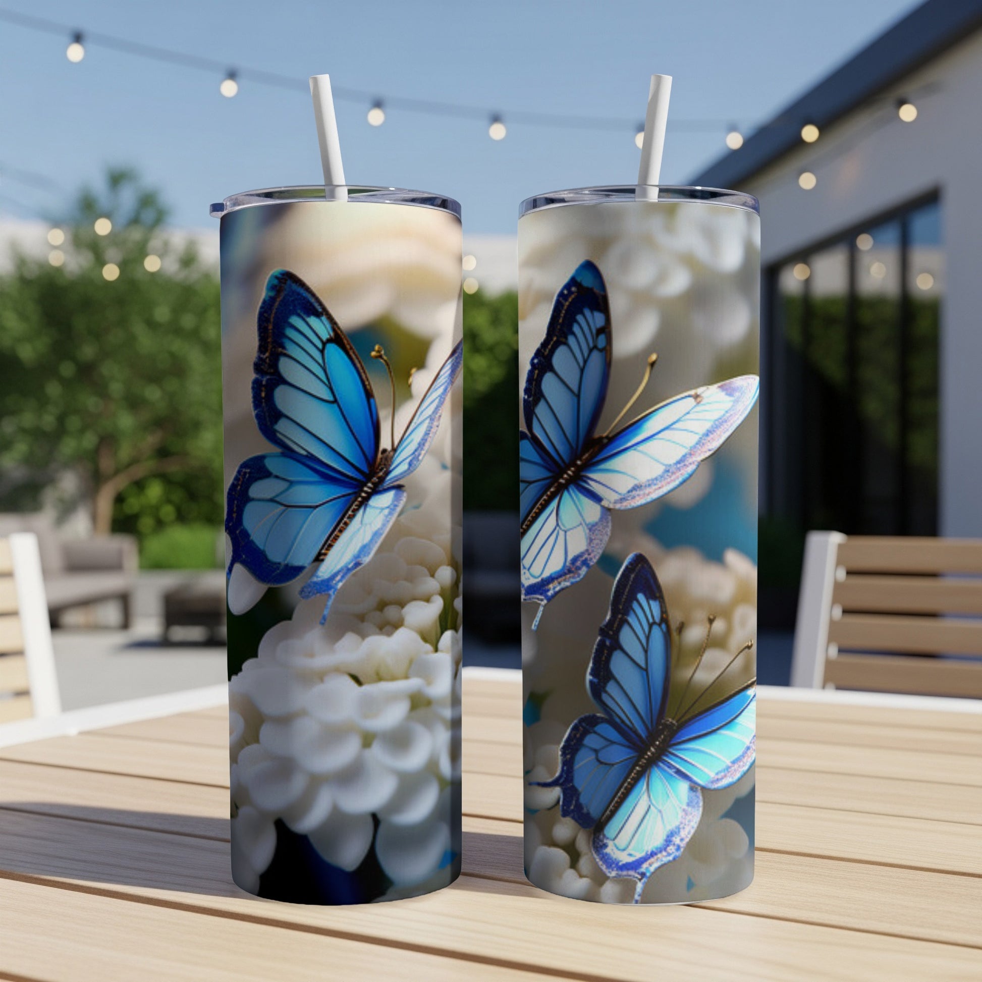 Two blue butterflies on white flowers, on tumblers.