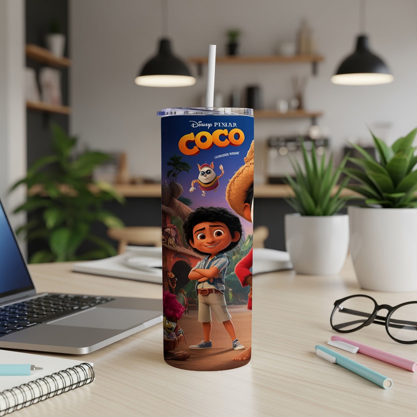 Disney Pixar Coco Miguel and Hector skinny tumbler on a desk.