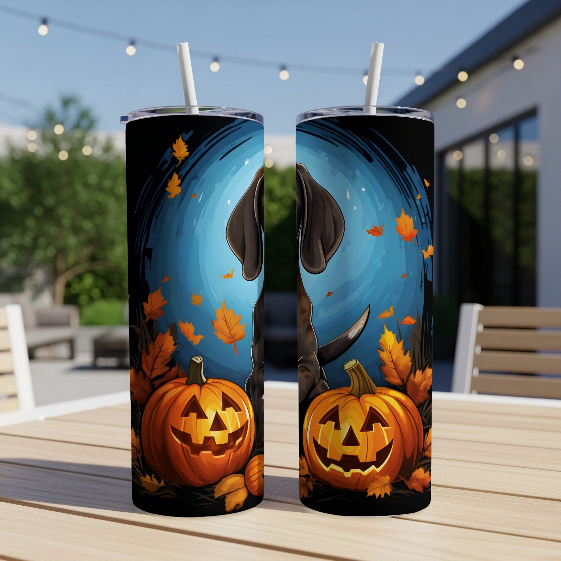 Two tumblers with Halloween design: dog, pumpkins, and falling leaves on black background.