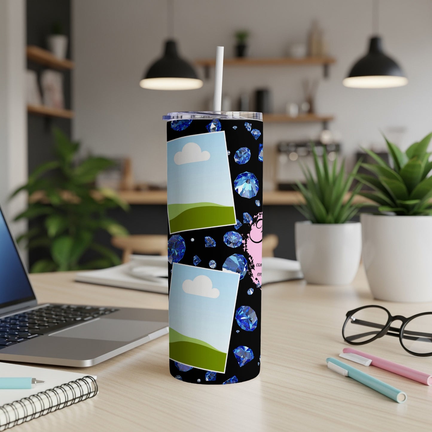 Black tumbler with blue diamonds, white clouds, green hills, and pink accents.