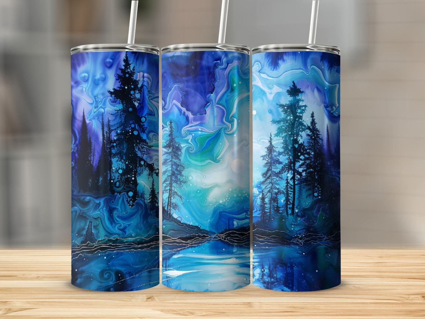 Three blue tumblers with a starry night forest and lake design.