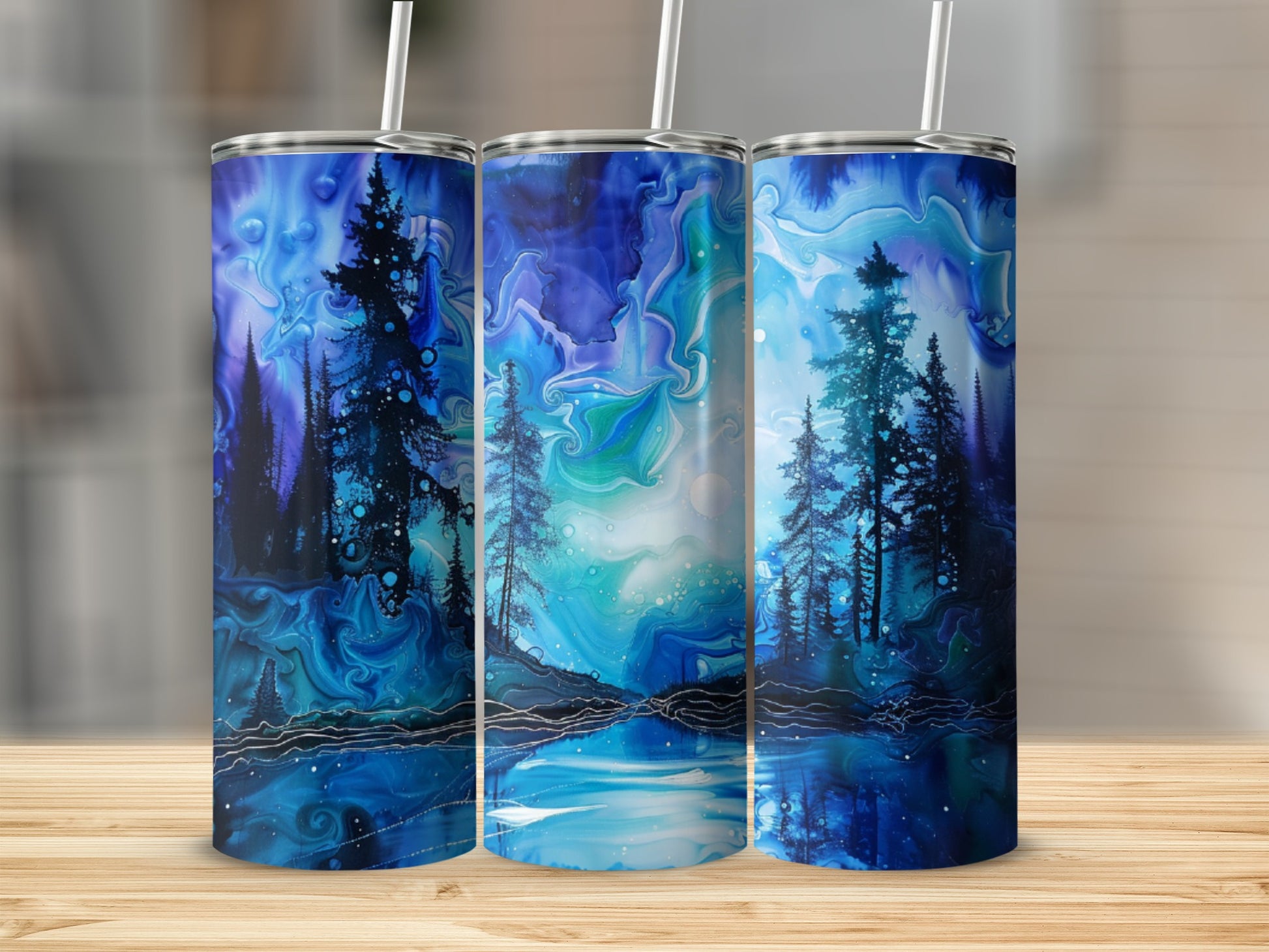 Three blue tumblers with a starry night forest and lake design.