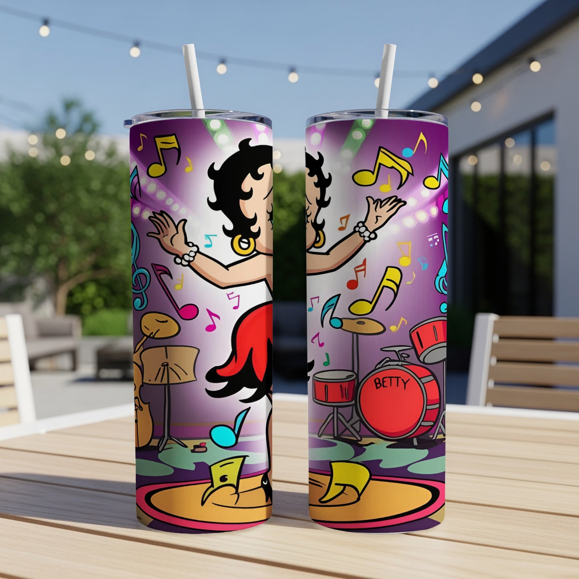 Betty Boop performing on stage with musical notes and drums.