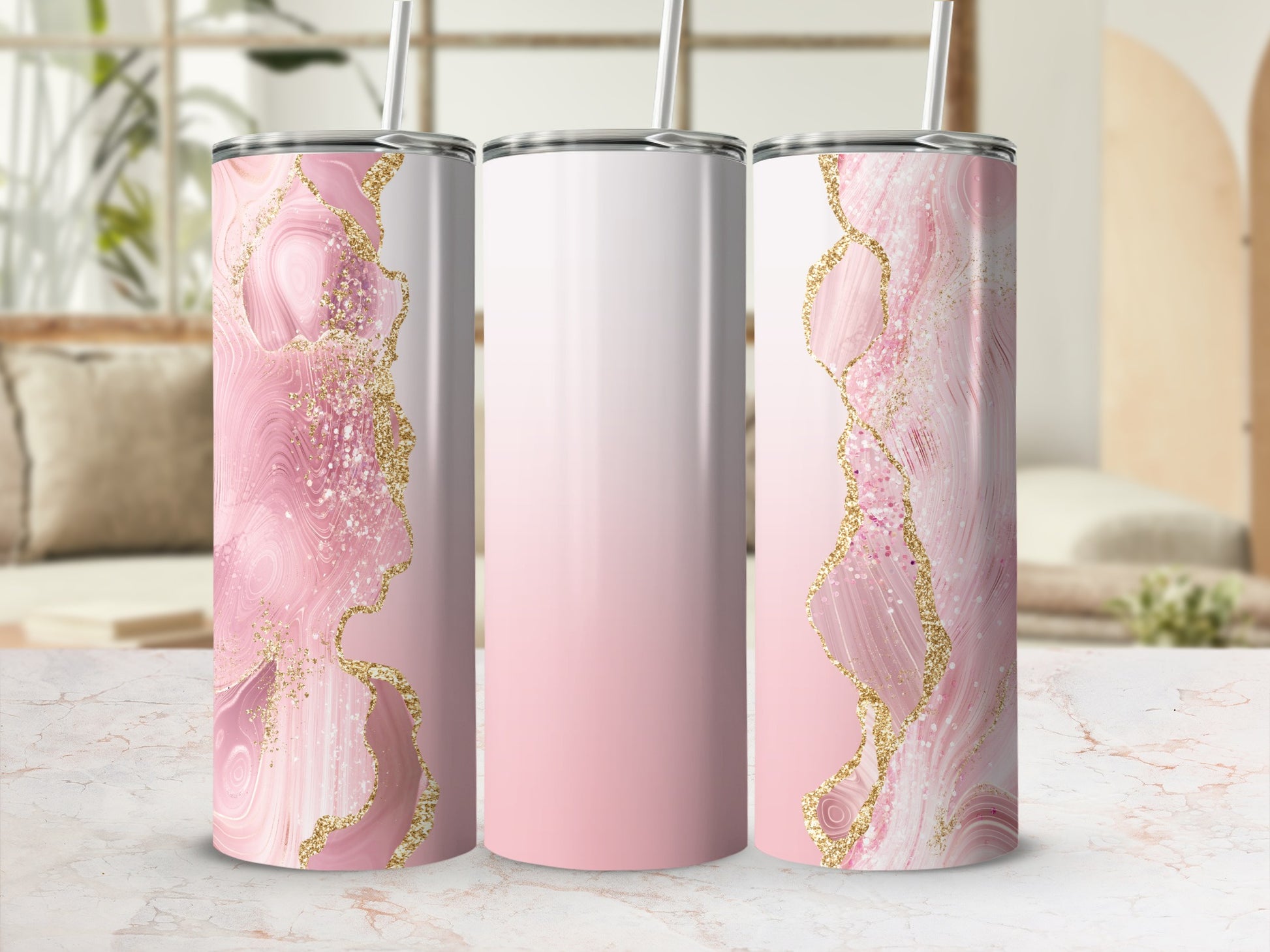 Pink marble and gold glitter tumbler with straw.