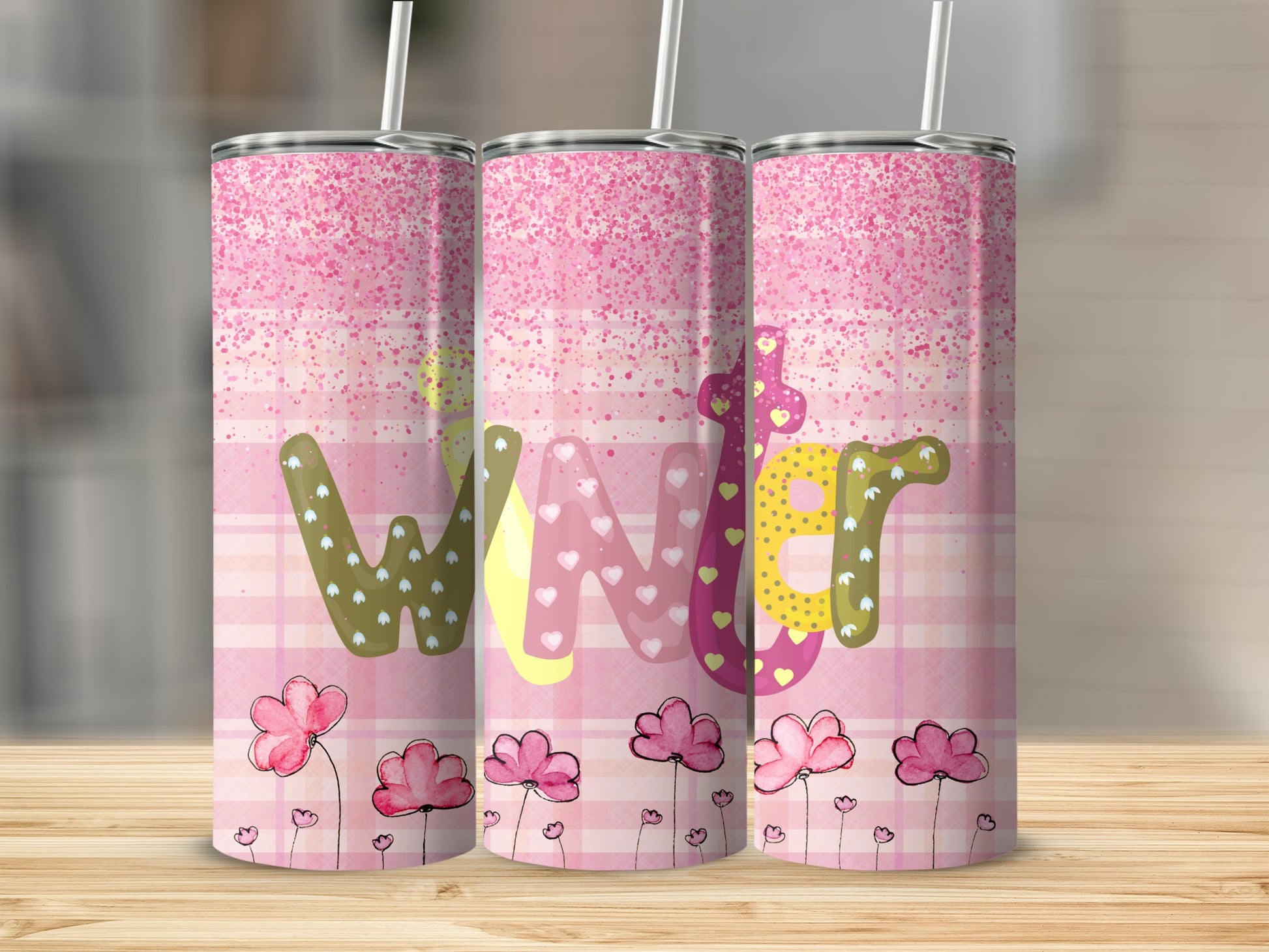 Pink plaid tumbler with "Wonderful" text and floral accents.