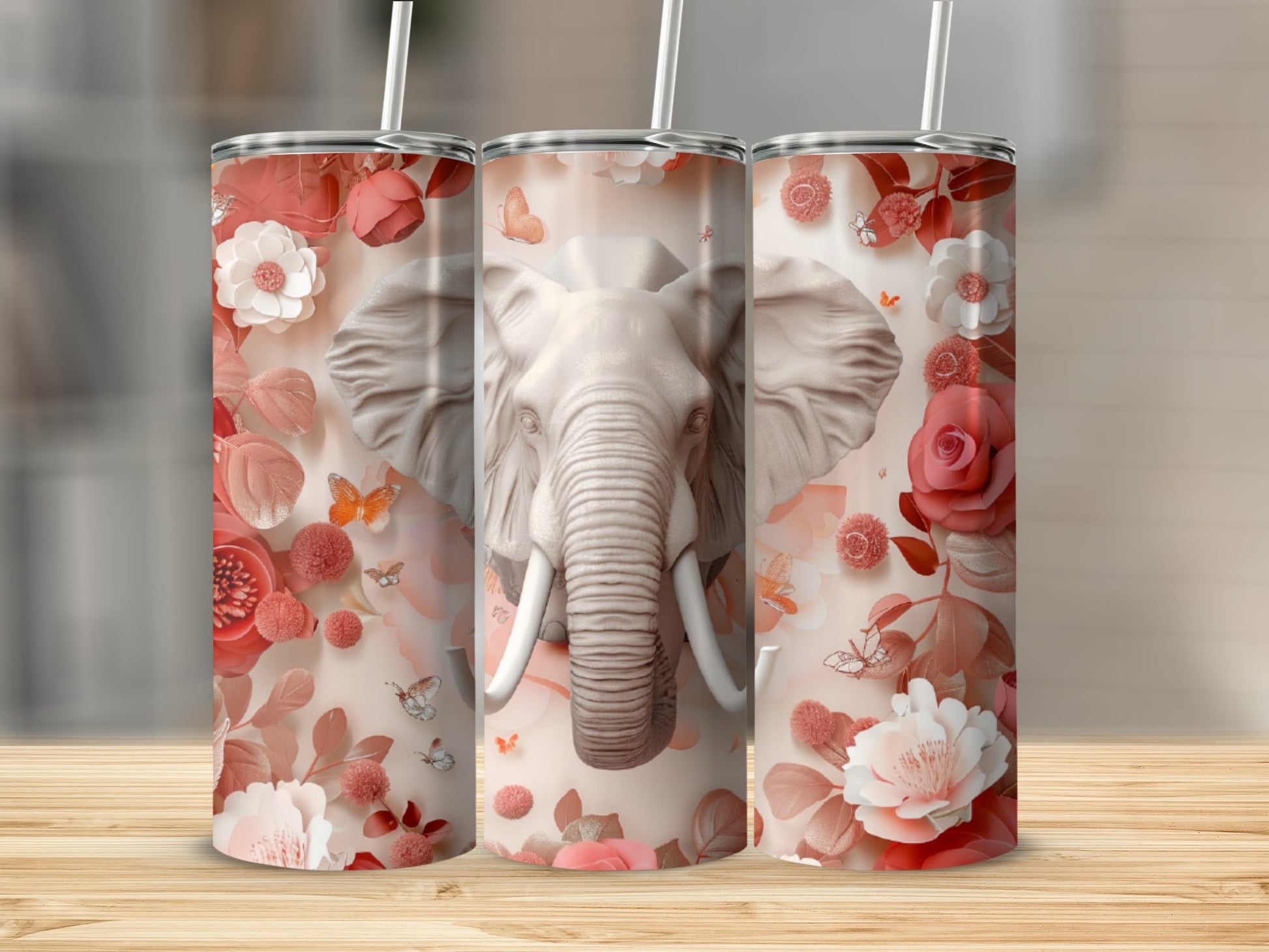 Three tumblers with an elephant head and floral design.