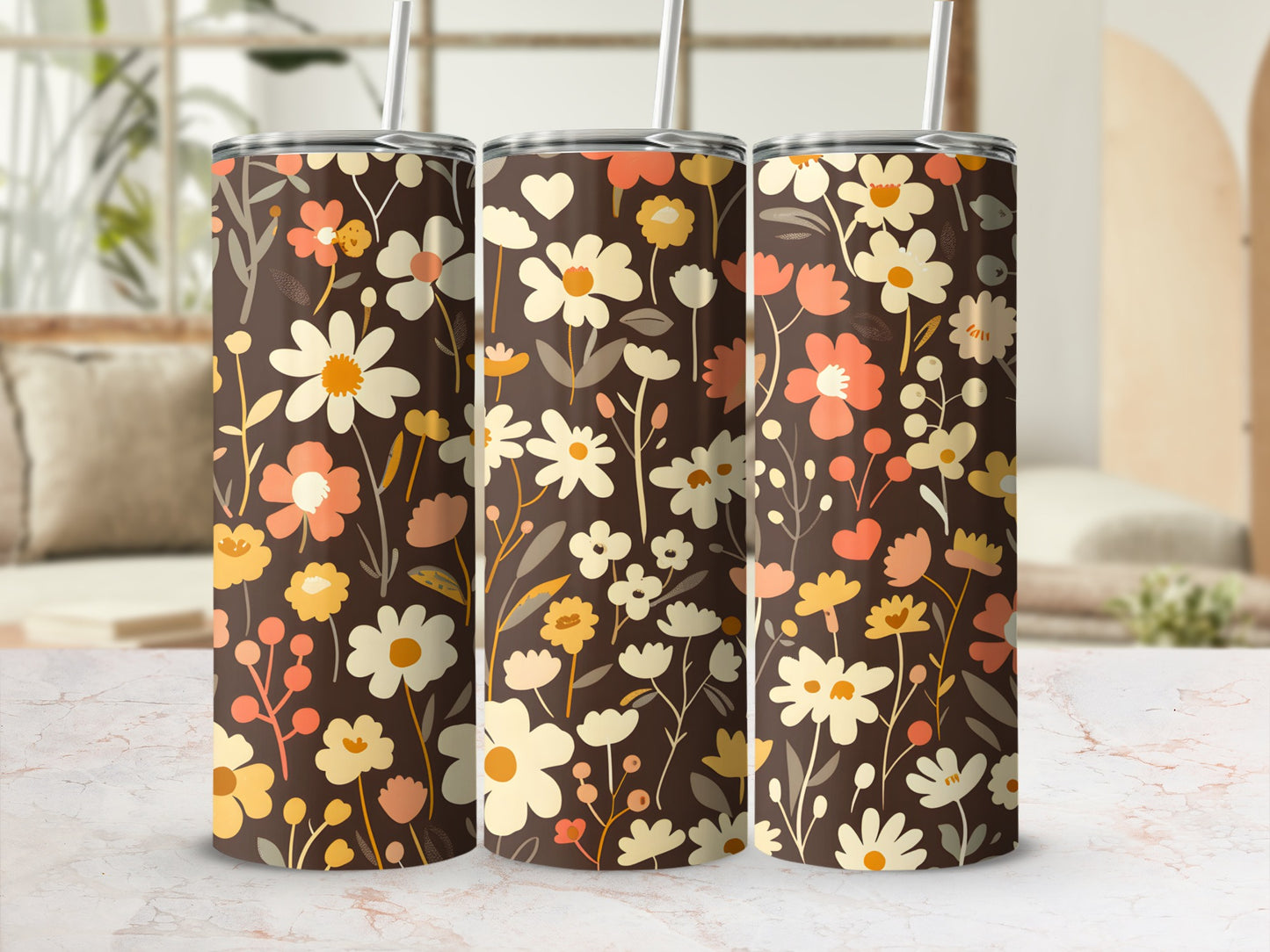 Three tumblers with a brown floral pattern and straws.