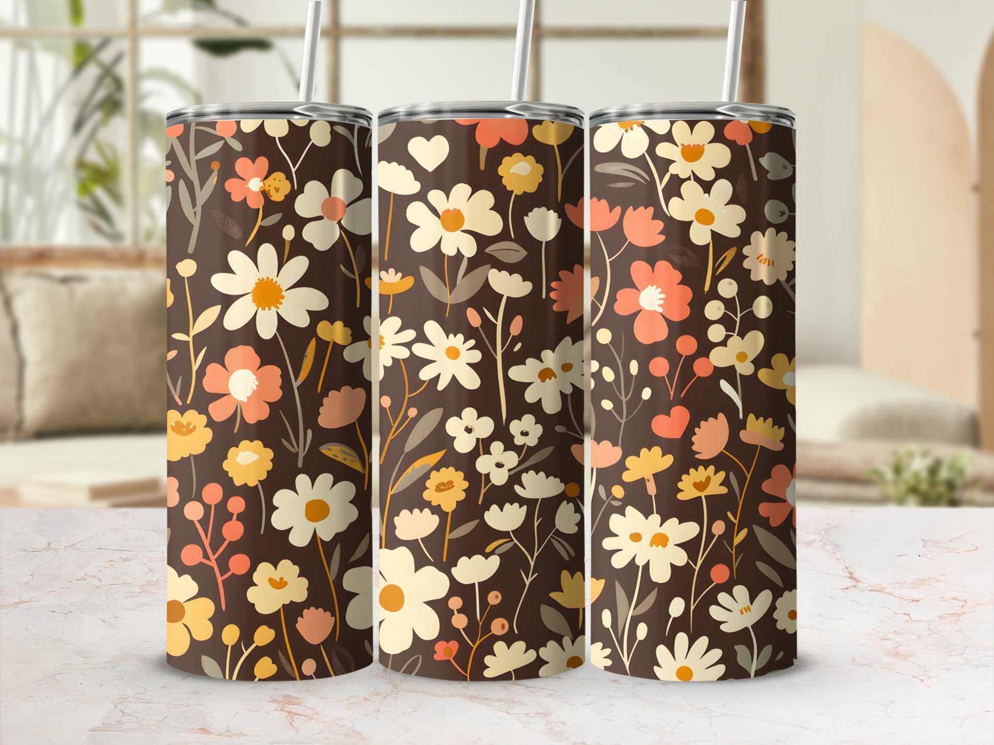 Three tumblers with a brown floral pattern and straws.