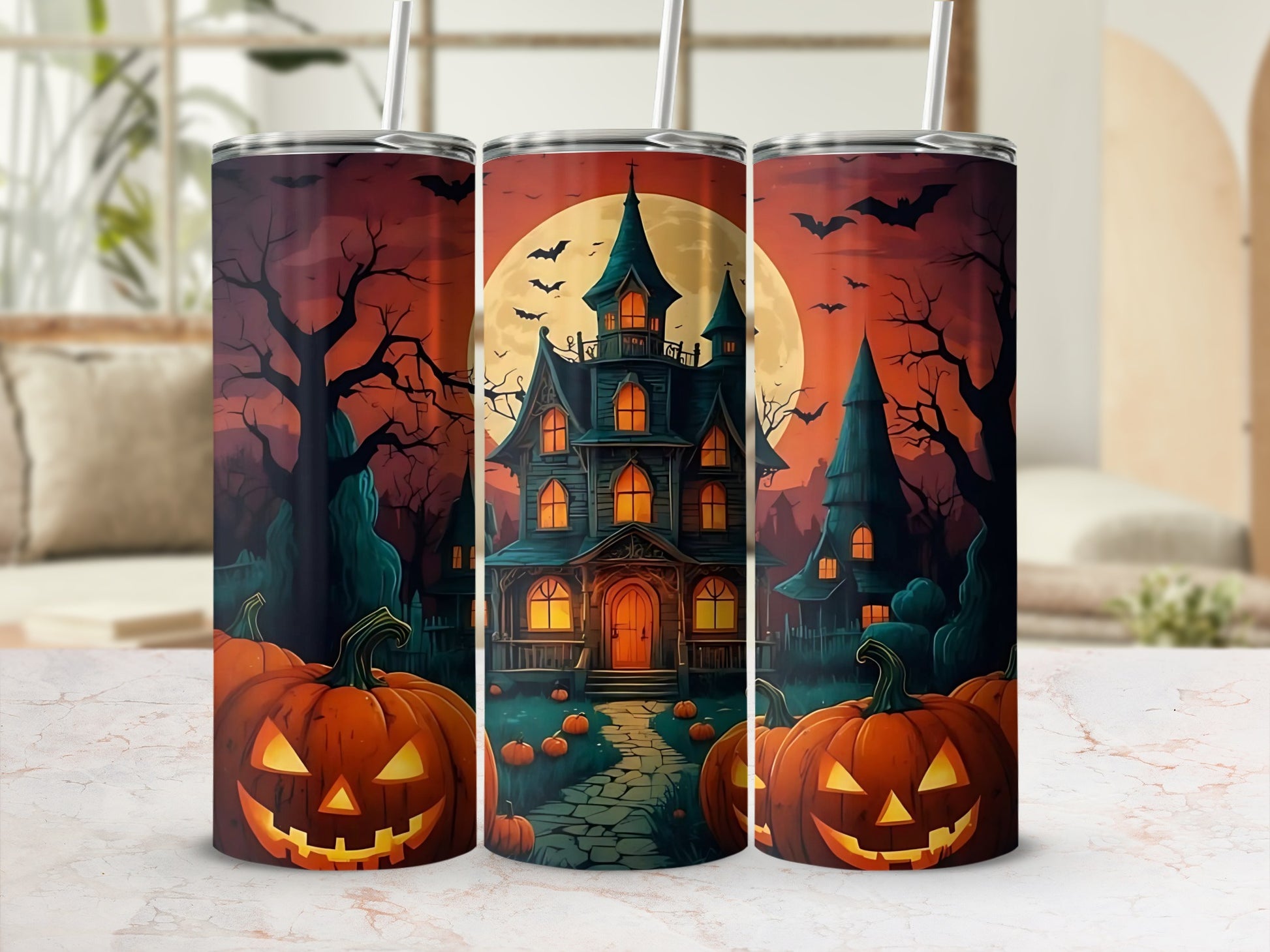 Trio of tumblers featuring a Halloween scene with a haunted house, pumpkins, bats, and a moon.