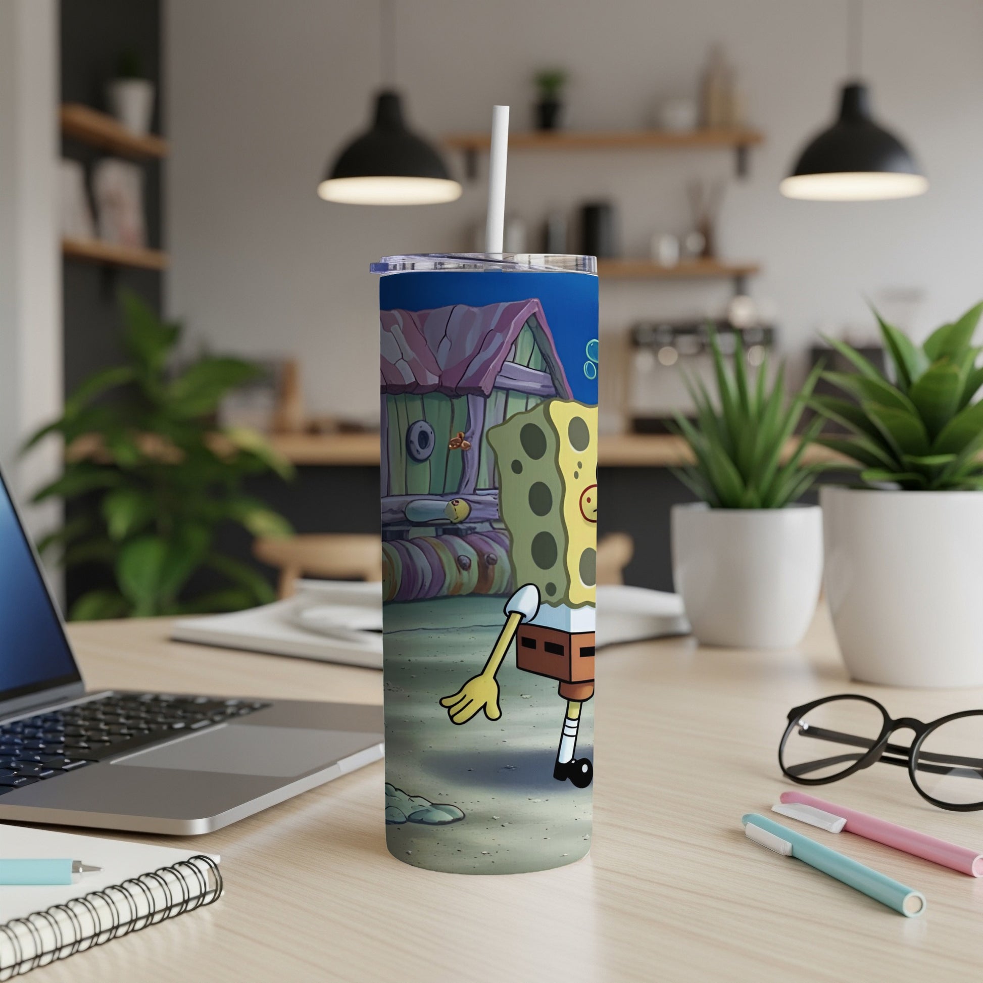 SpongeBob SquarePants character on a tumbler with a straw.
