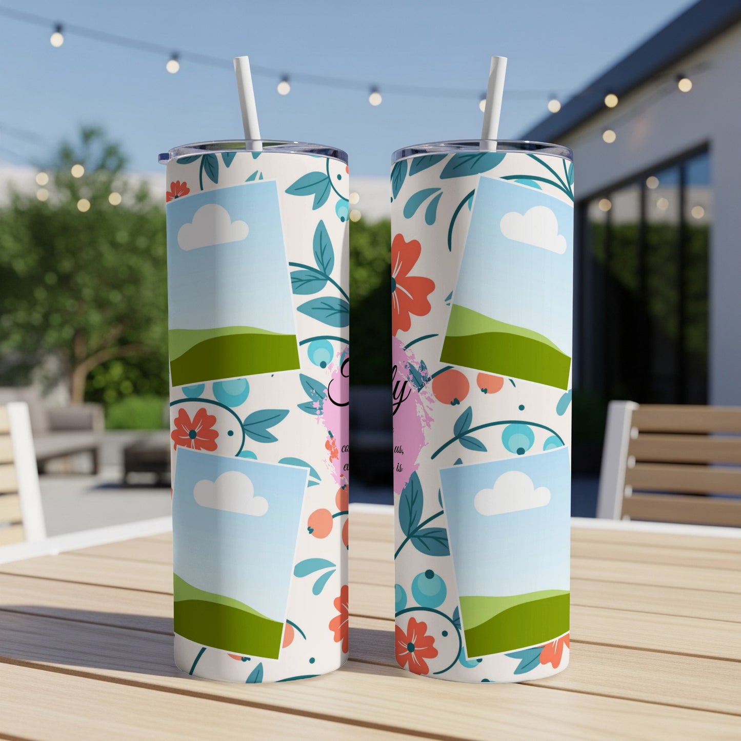 Two tumblers with a floral design and photo frame elements on a wooden table.