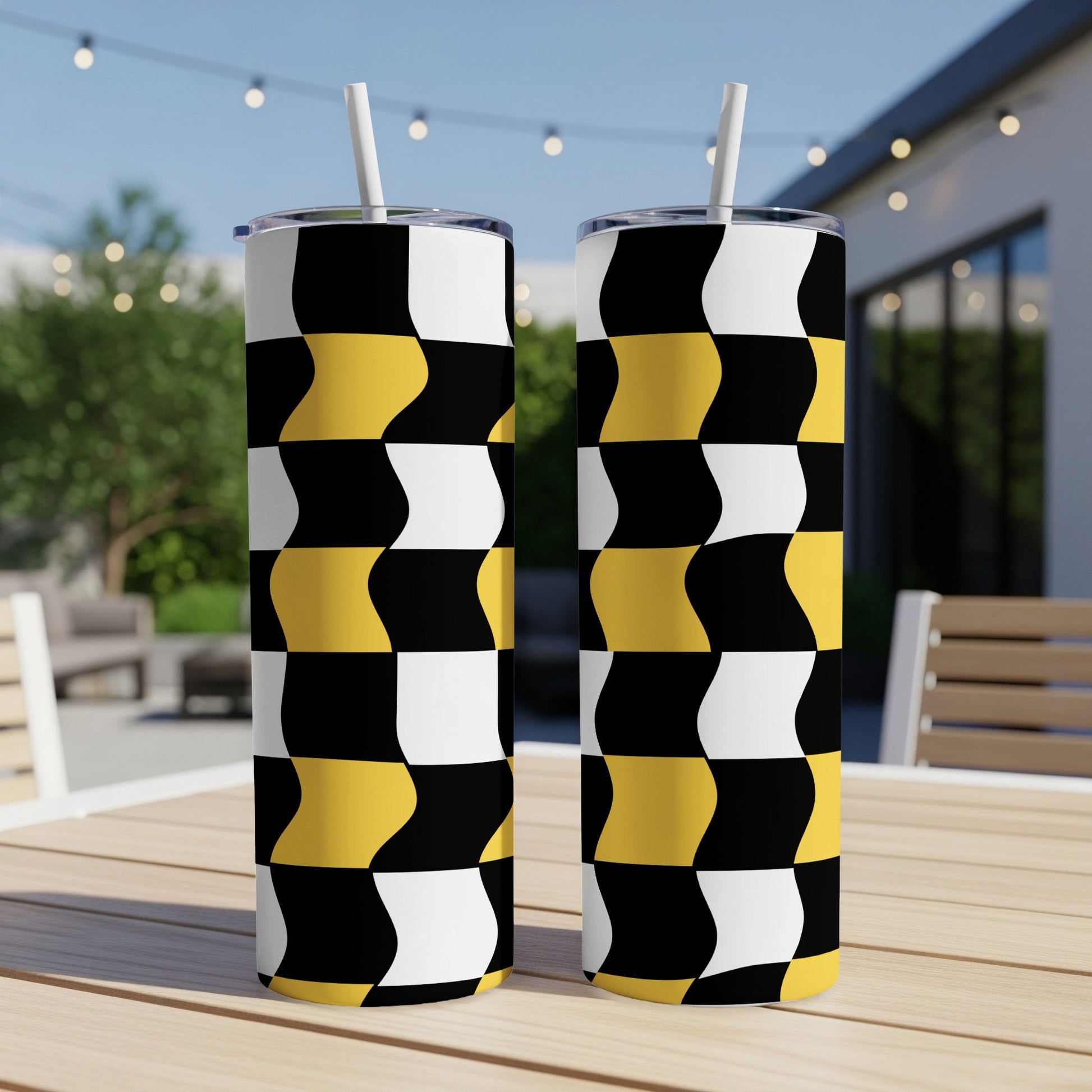Two tumblers with a black, white, and yellow checkered wavy pattern.