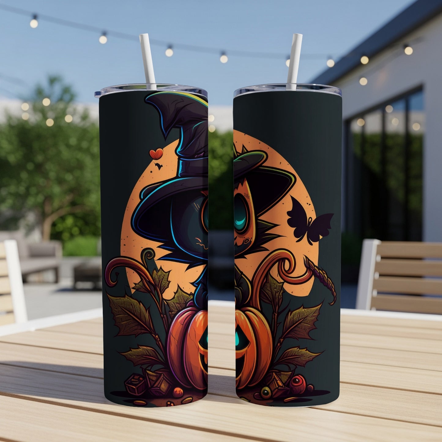 Two tumblers featuring a Halloween witch cat design with pumpkins and leaves.