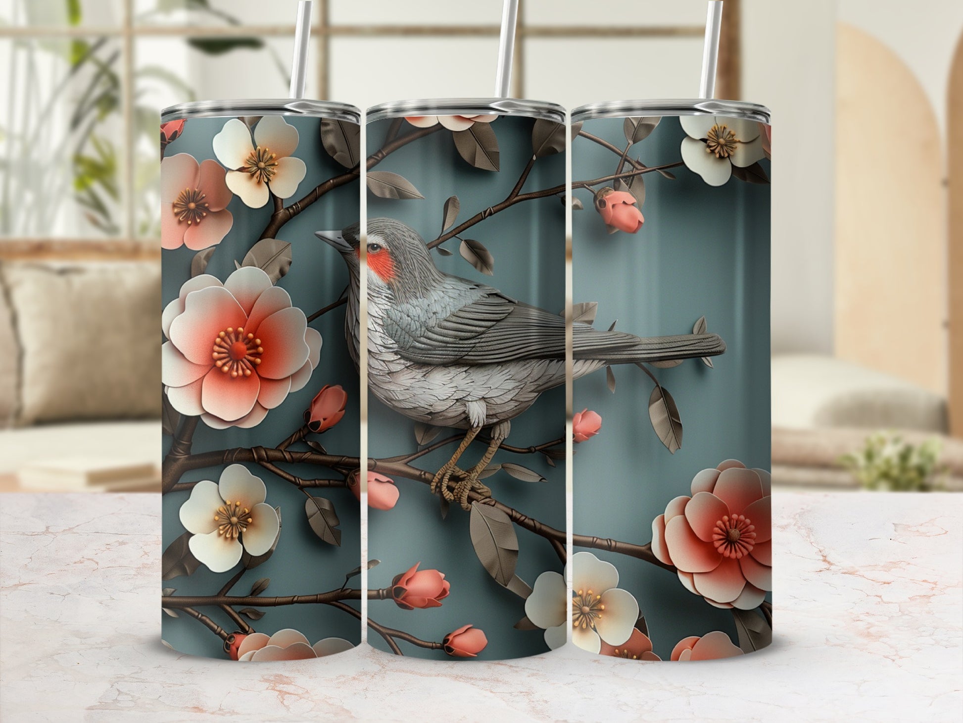 Tapered tumbler with a gray bird perched on a branch with pink and white flowers.