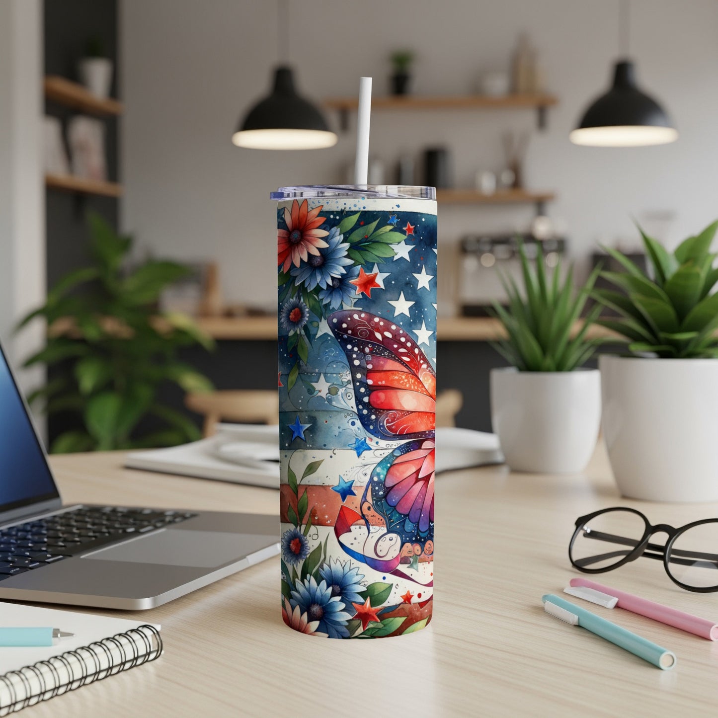 Tall tumbler with butterfly and floral patriotic American flag design.