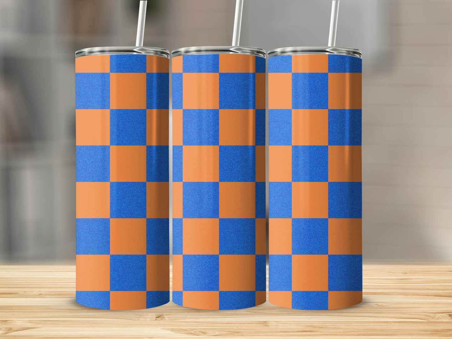 Three tall tumblers with orange and blue checkered pattern.
