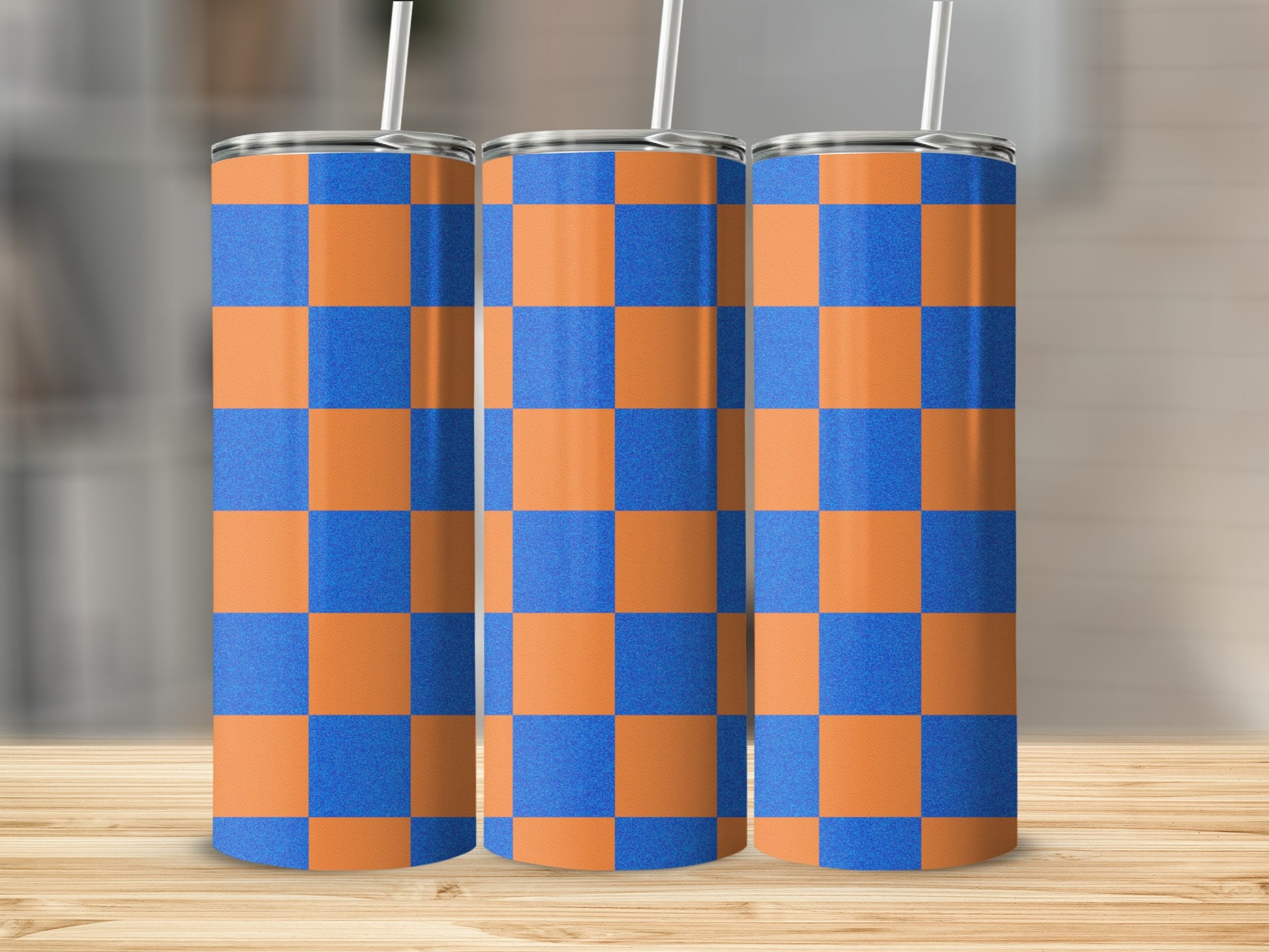 Three tall tumblers with orange and blue checkered pattern.