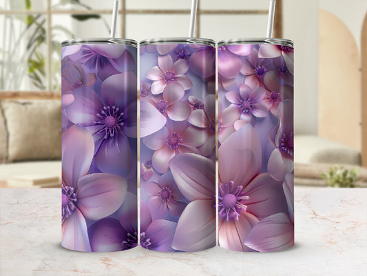 Three tumblers featuring a purple floral pattern in a studio setting.