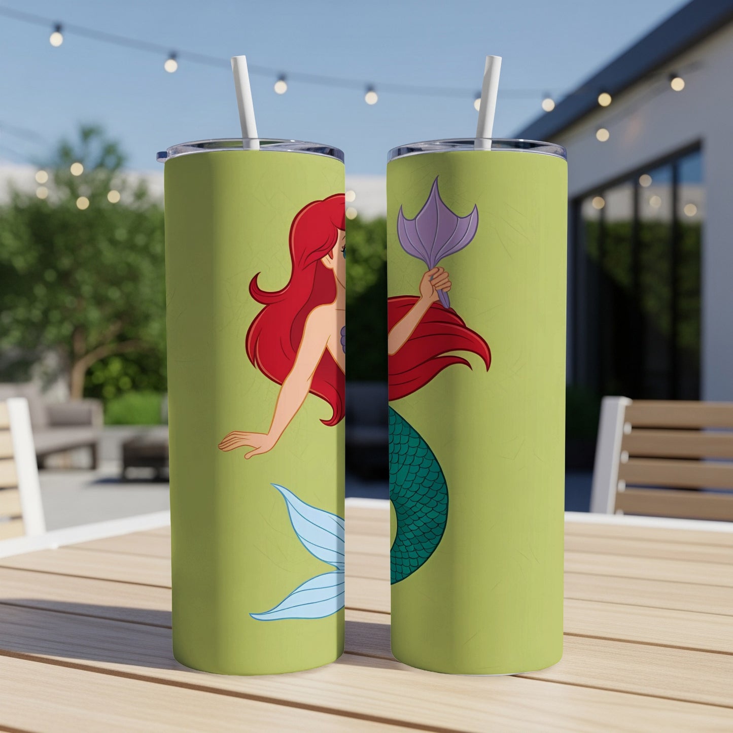 Ariel the mermaid on a green tumbler with blue fins and purple tail.