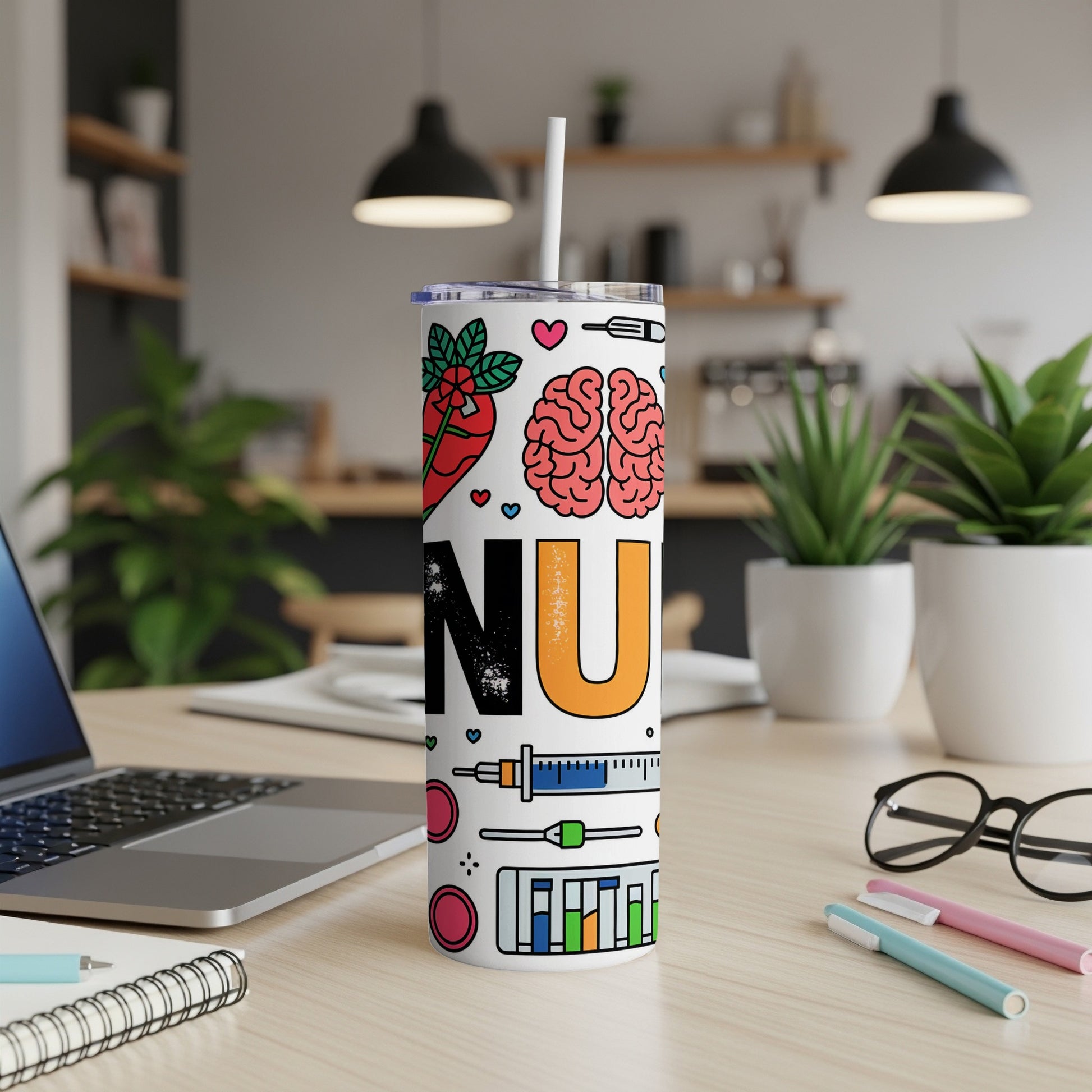 White tumbler with medical icons and "NU" text on a desk.