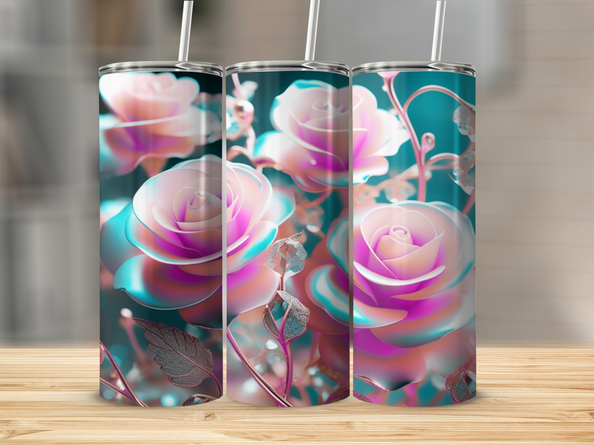 Three tumblers with pink and blue rose designs sit on a wooden surface.