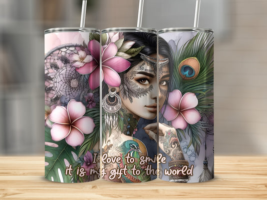 Woman with tattoos and flowers, "I love to smile is my gift to the world" text.