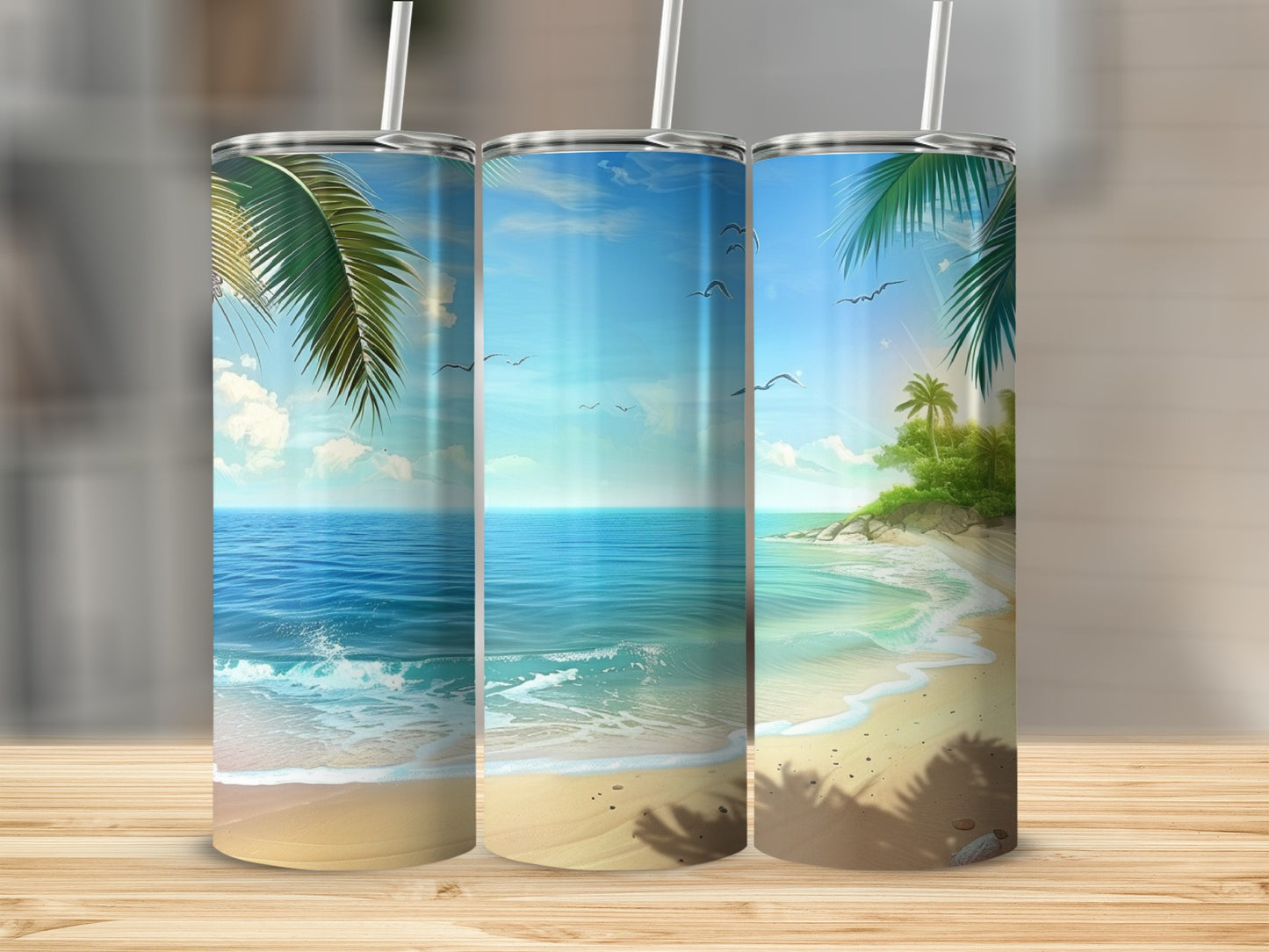 Three tumblers with tropical beach scene art.