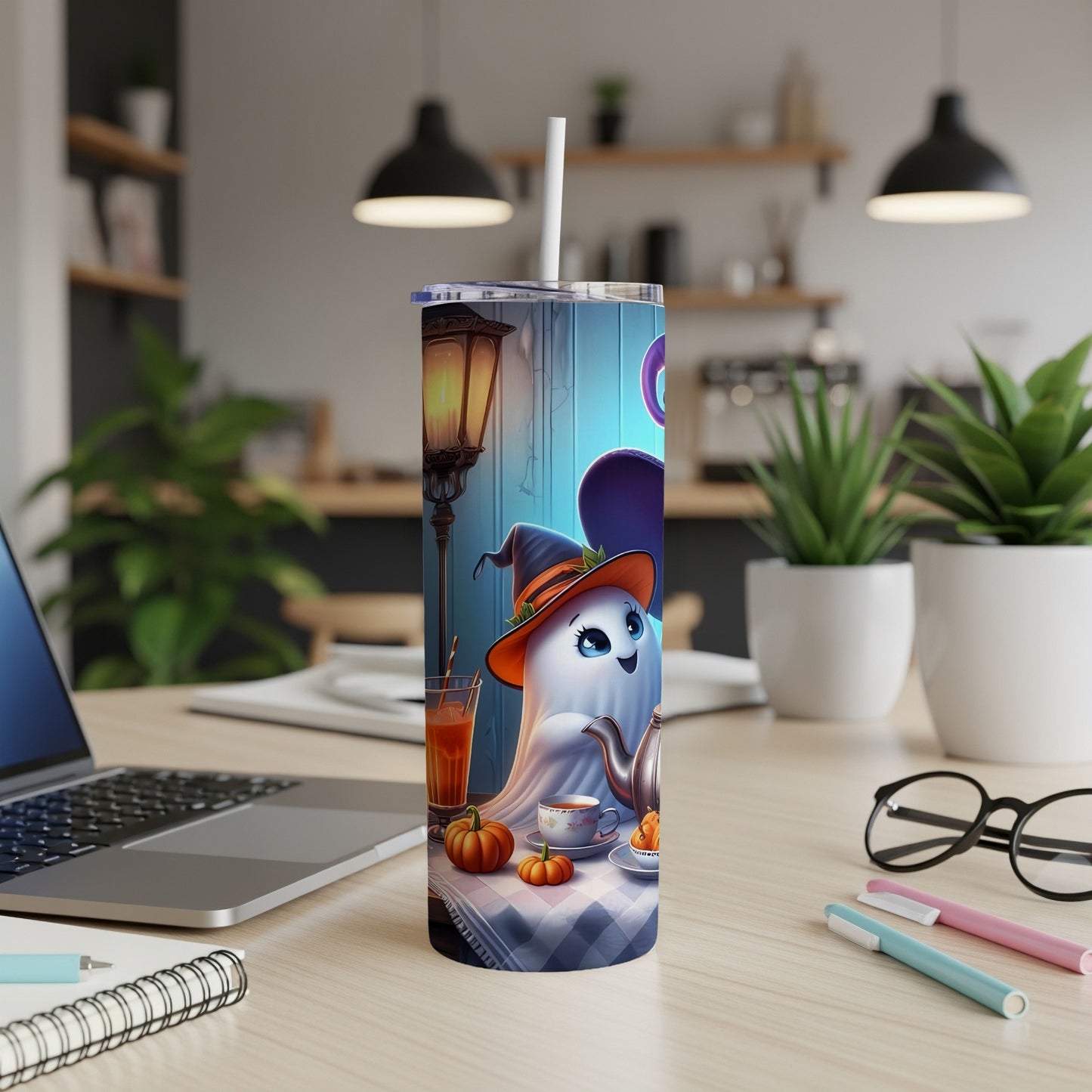 Tumbler with cartoon ghost in witch hat, tea set, and pumpkins.
