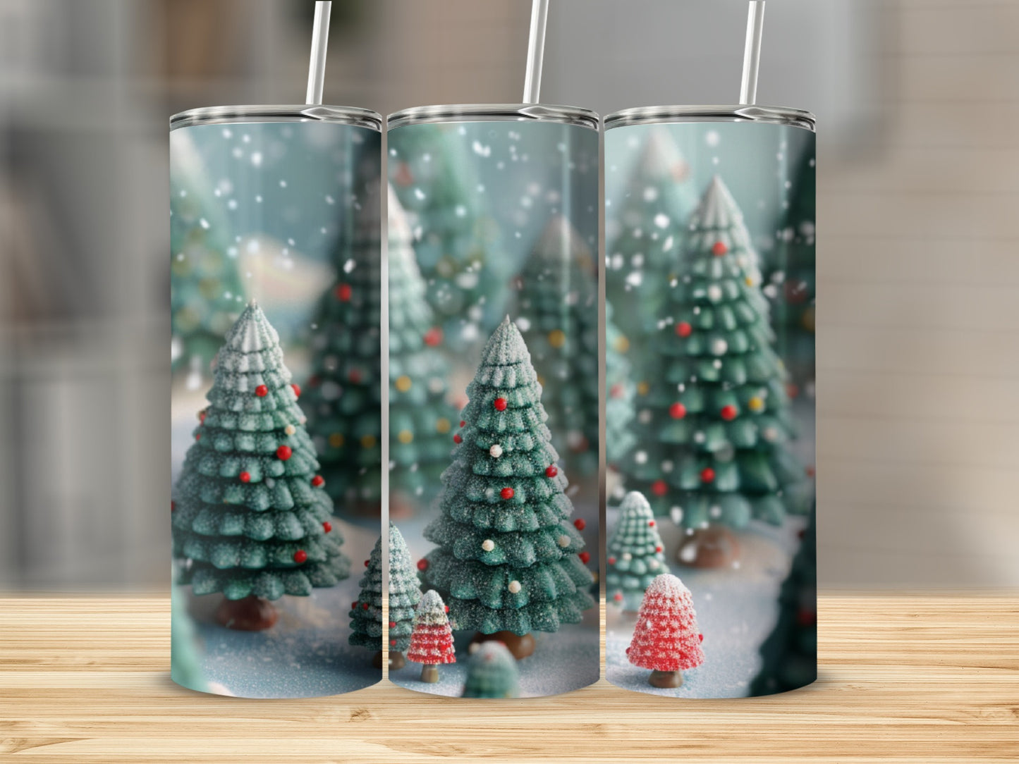 Three tumblers with a winter forest scene featuring snow-covered evergreen trees.