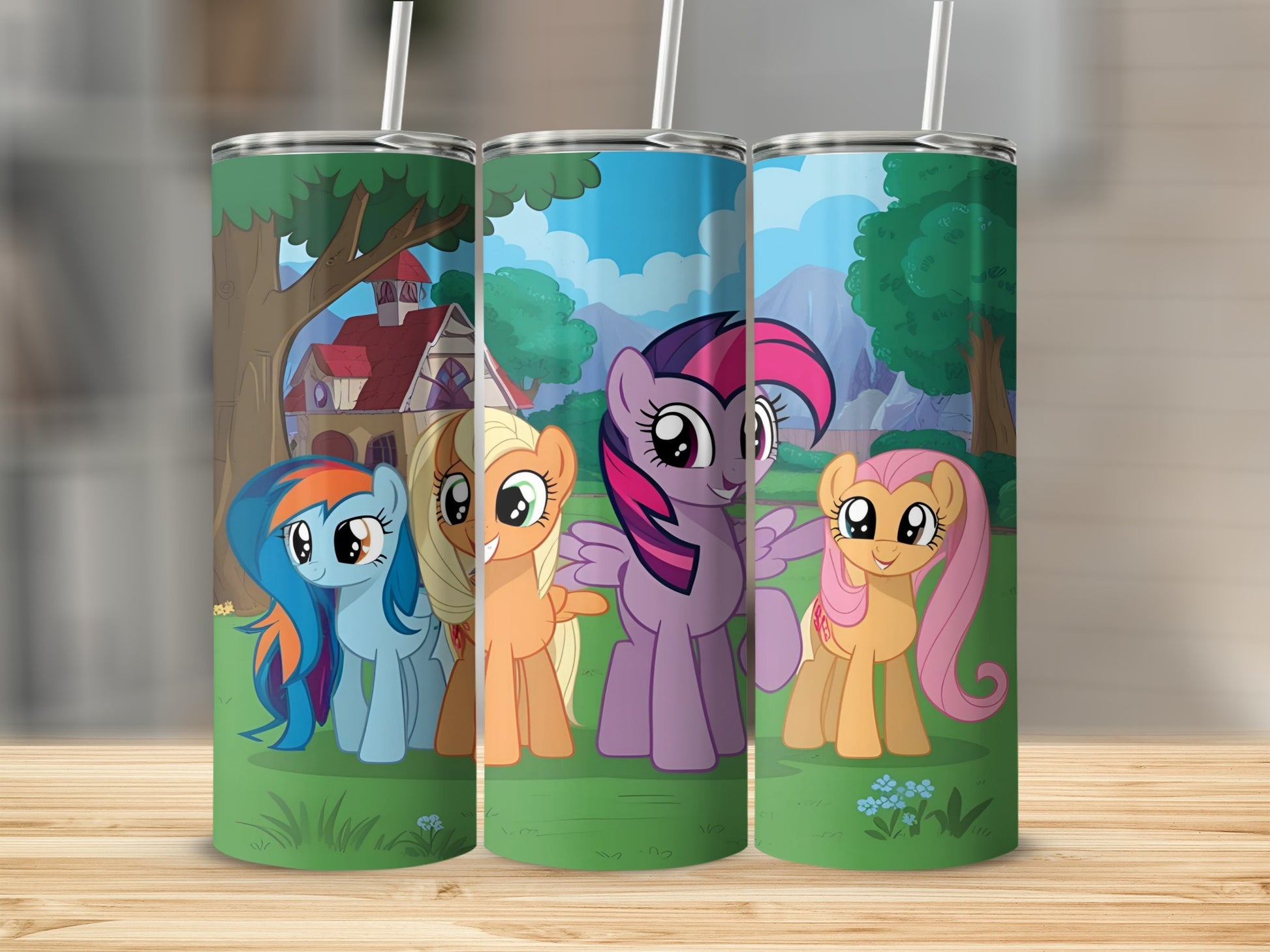 My Little Pony characters Rainbow Dash, Applejack, Twilight Sparkle, and Fluttershy on a colorful tumbler.