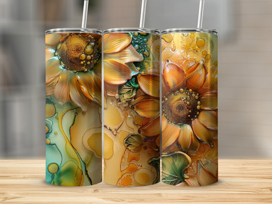 Three tall tumblers featuring embossed sunflowers and abstract golden alcohol ink designs.