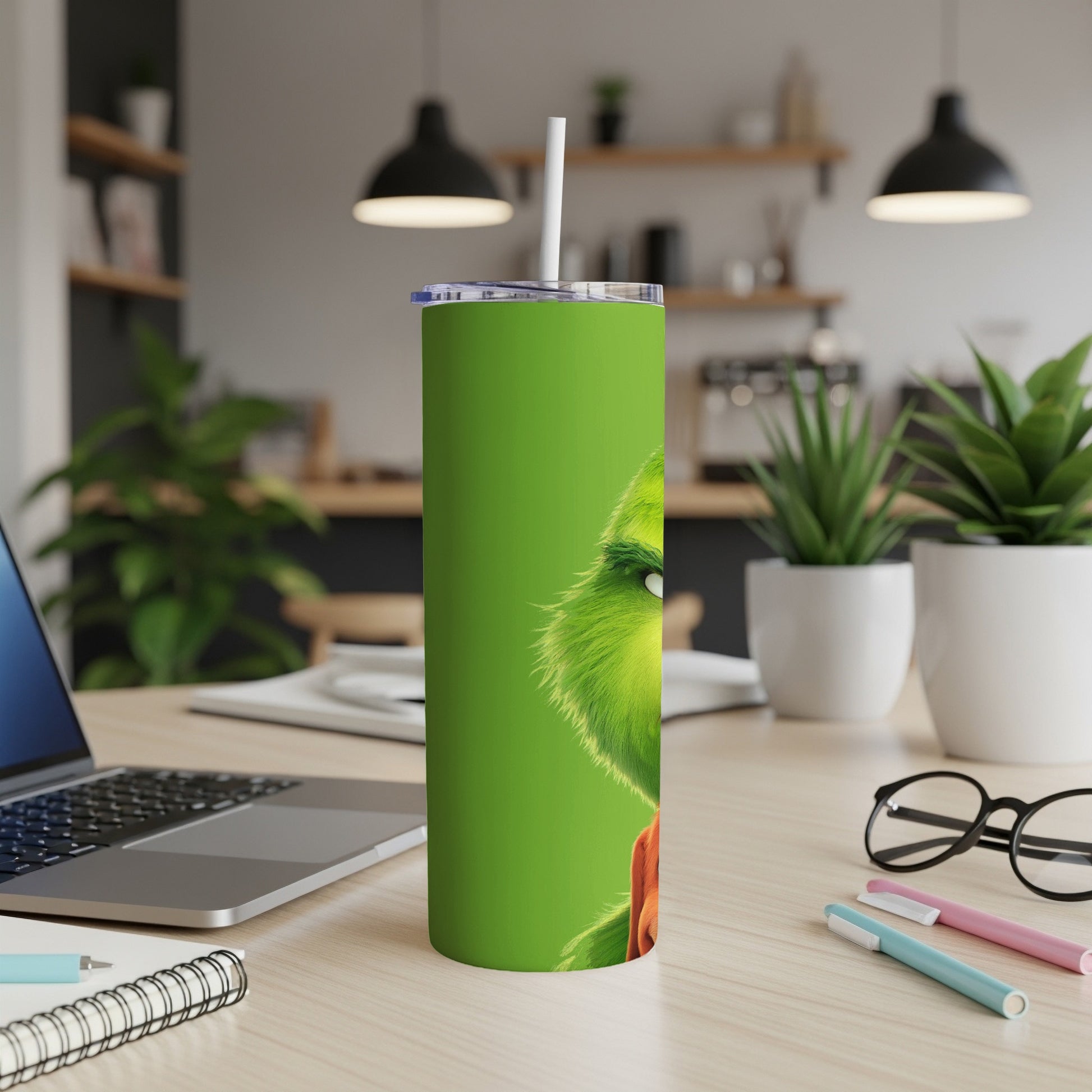 Grinch character on green tumbler with white straw.
