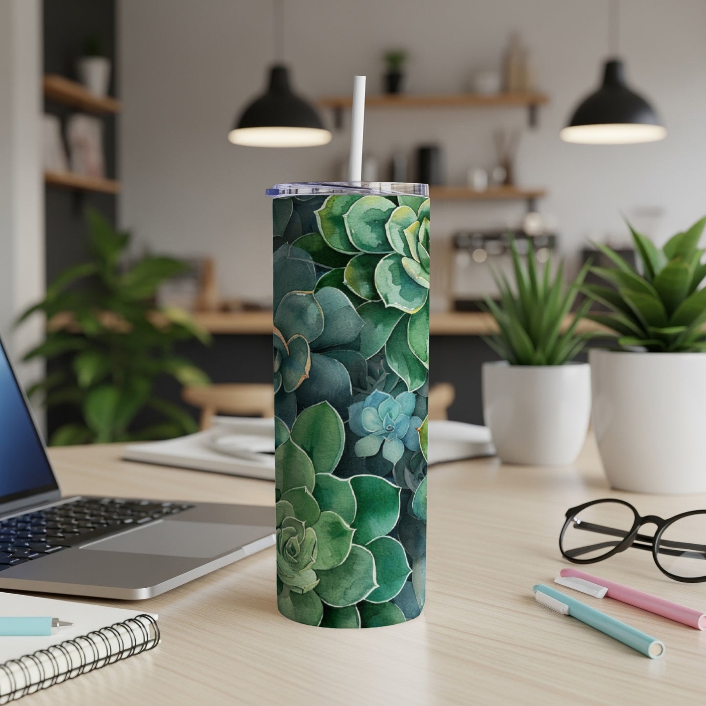 Green succulent pattern on a white stainless steel tumbler with a straw.