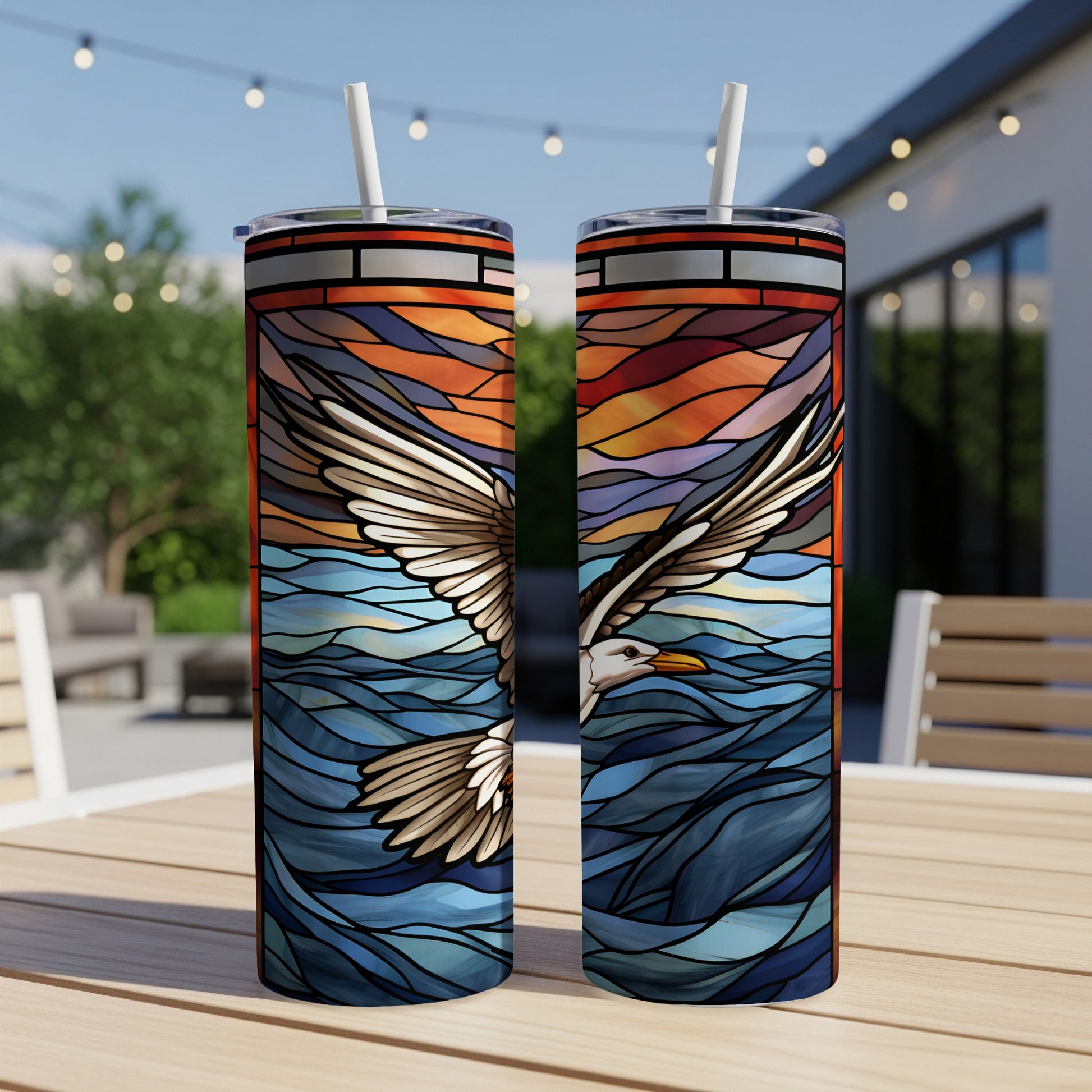 Seagull in flight over stained-glass waves on a skinny tumbler.