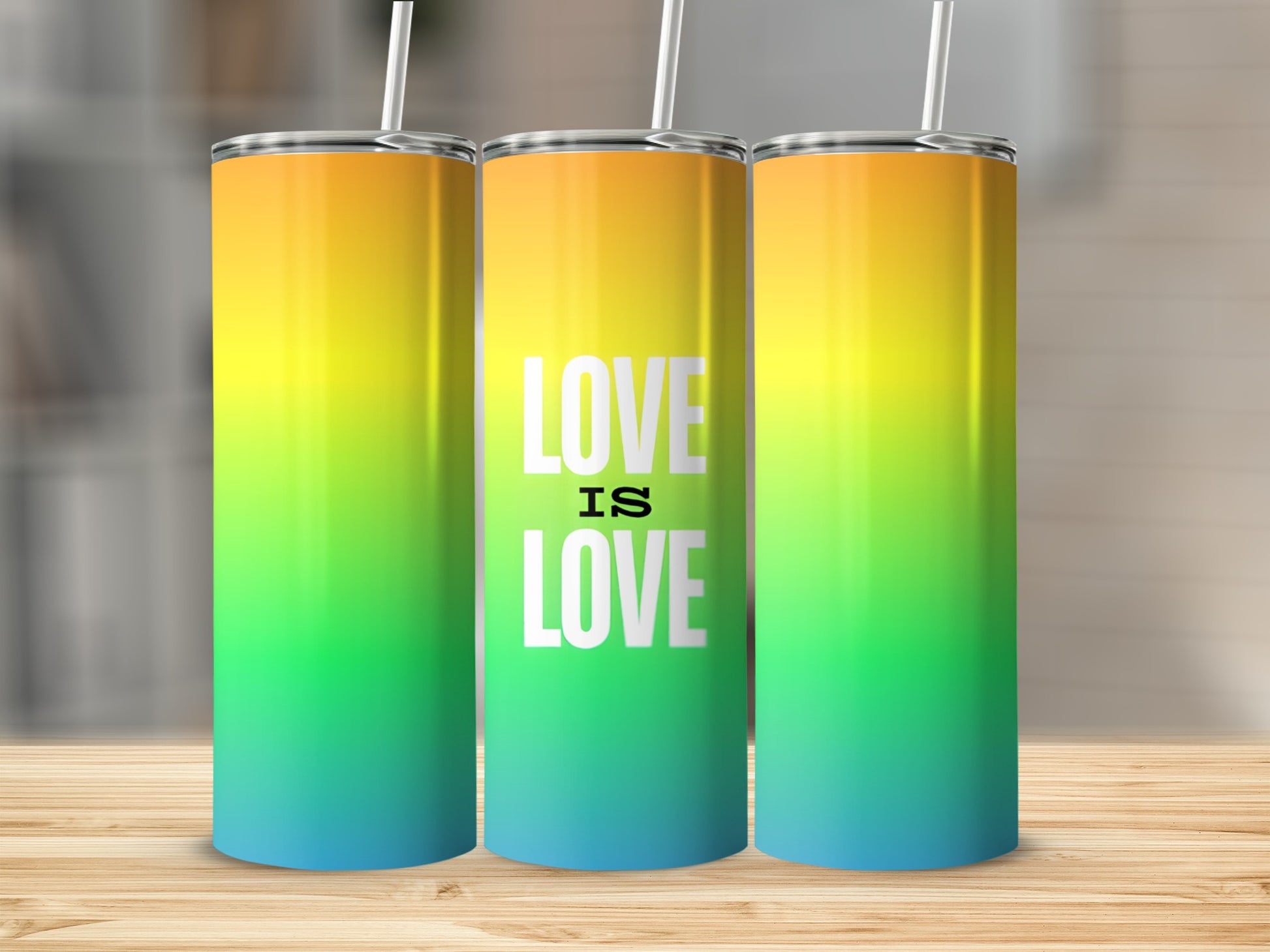 Three tumblers with rainbow gradient and "Love is Love" text.