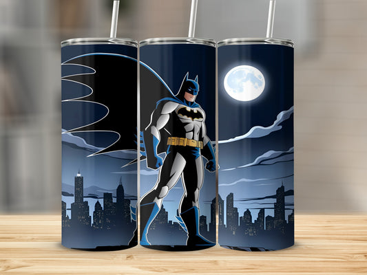 Batman standing in front of a city skyline at night.