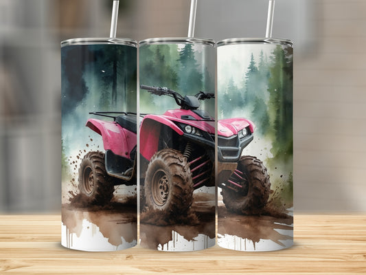 Pink ATV splashing through mud in a forest setting.