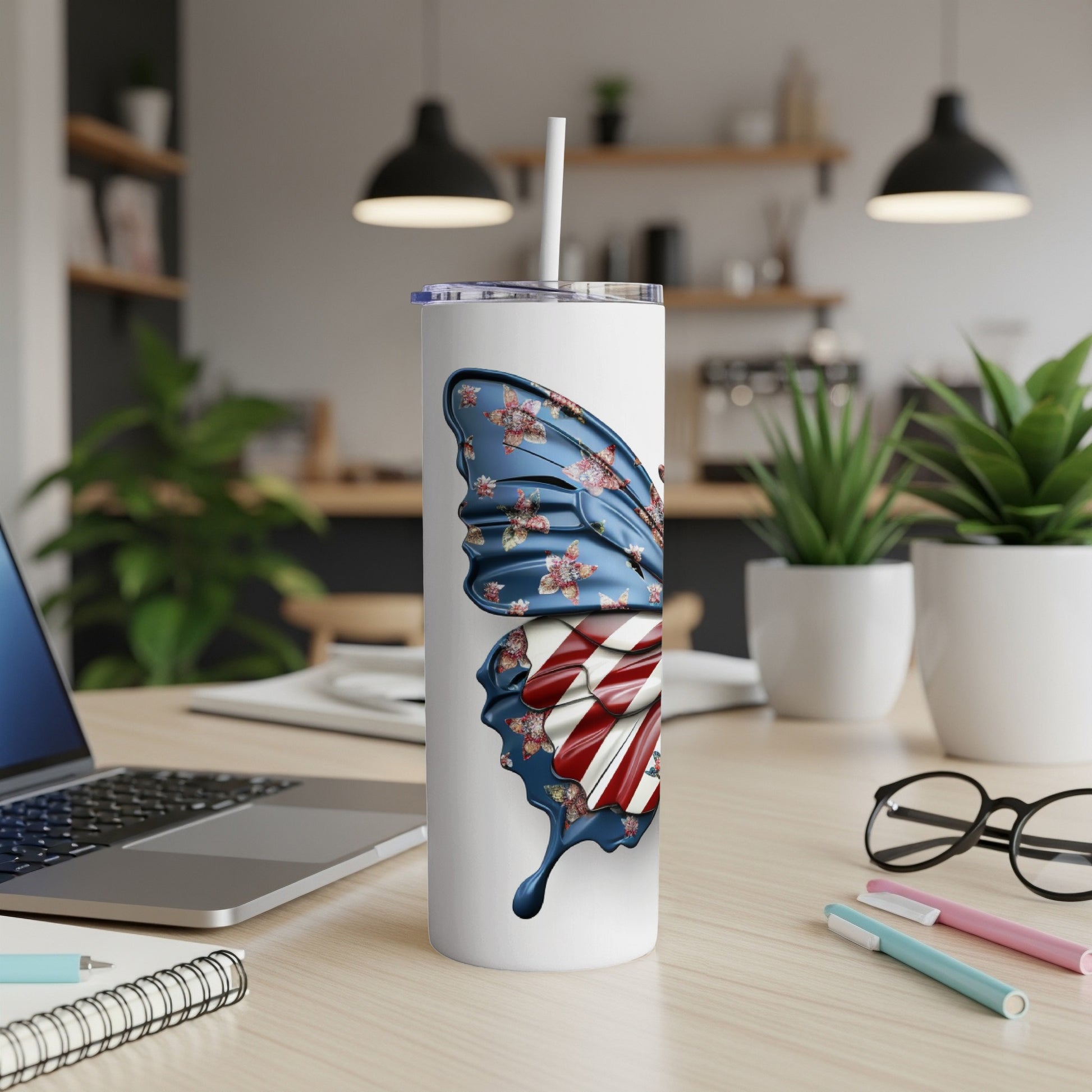 Tall white tumbler with a butterfly wing design featuring American flag colors and floral patterns.