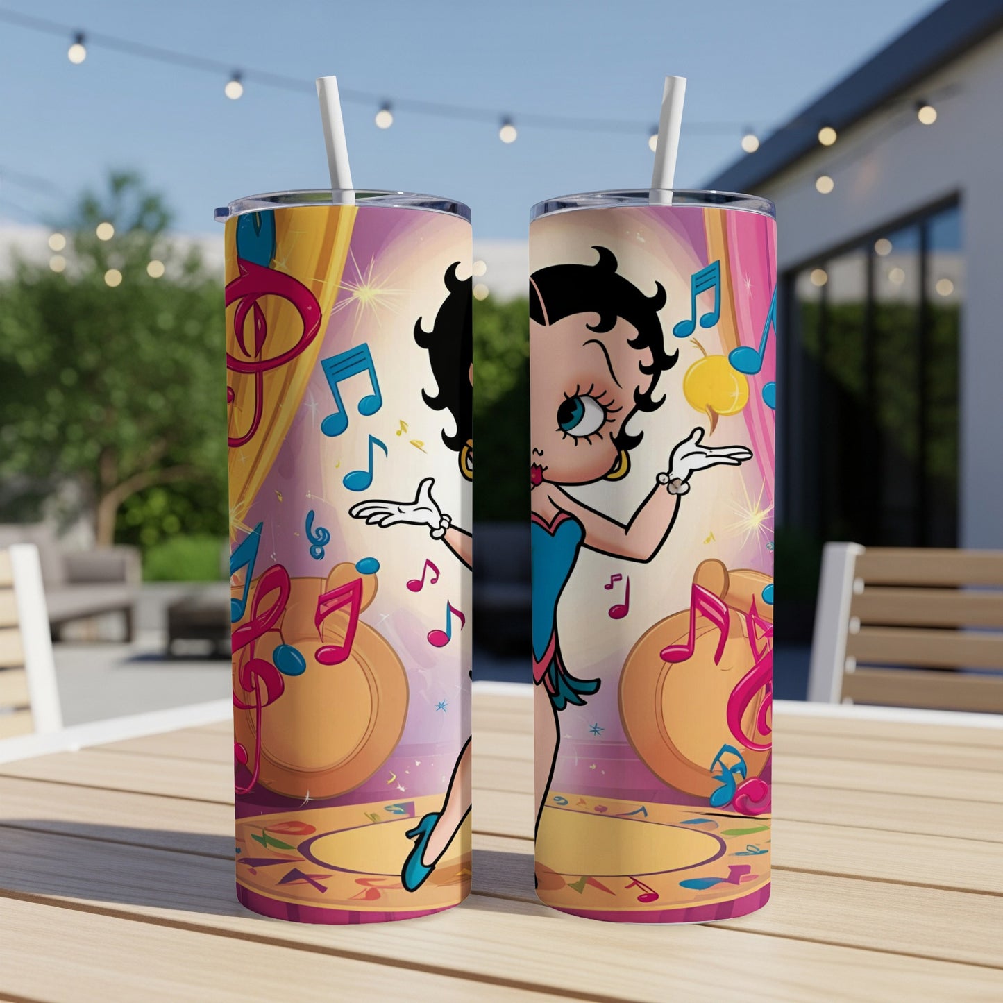 Betty Boop illustration on two cylindrical tumblers with musical notes.