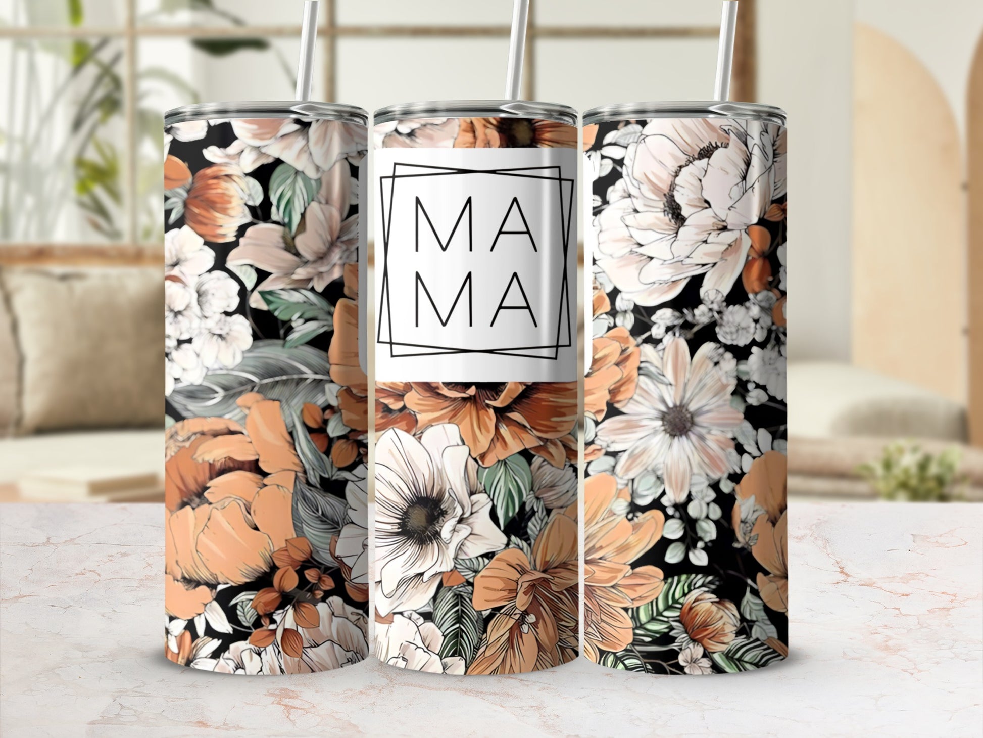 Floral mama tumbler with orange, white, and black flowers.