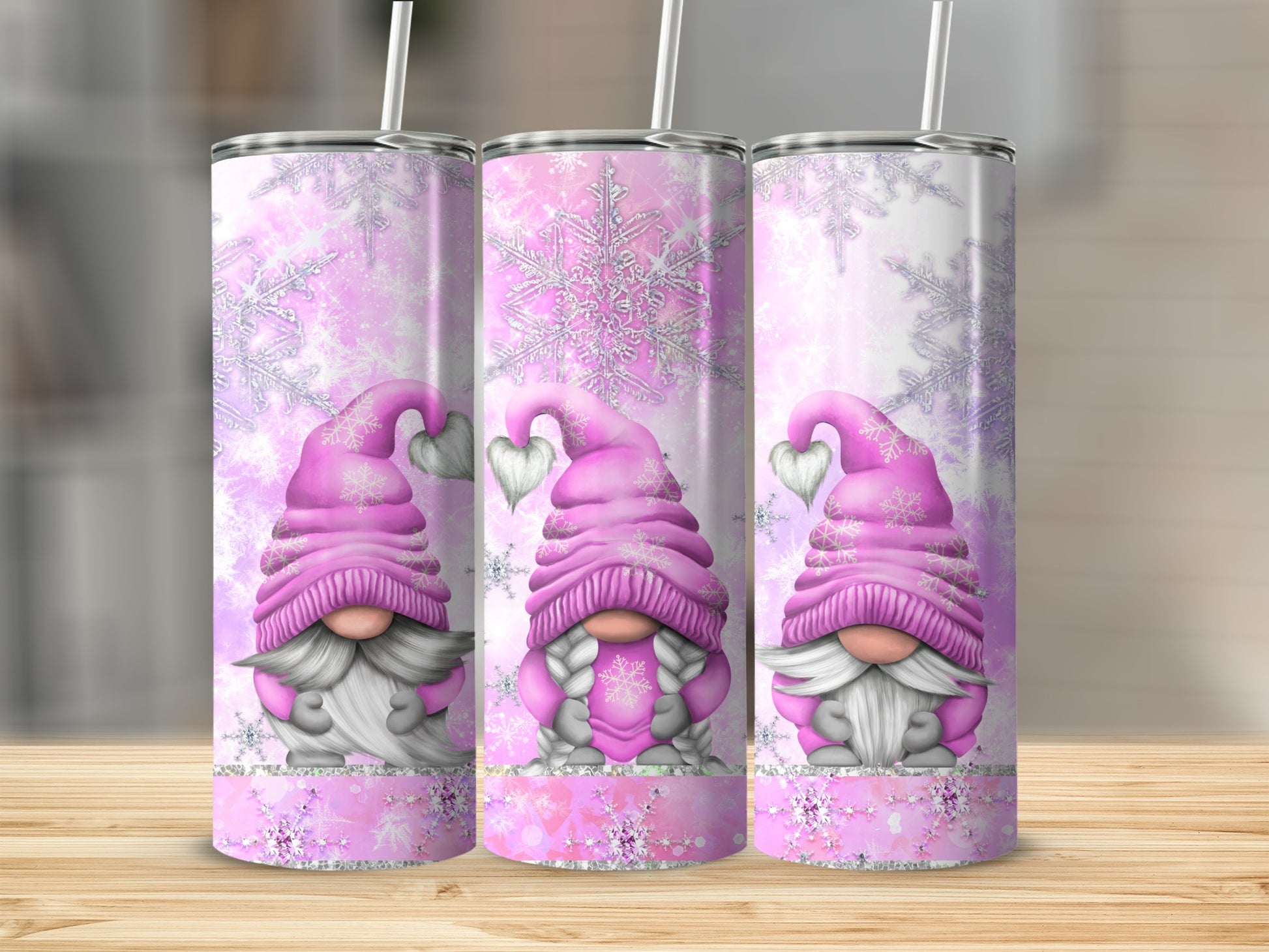 Three pink gnomes with hearts on hats, snowflakes, and subtle glitter.