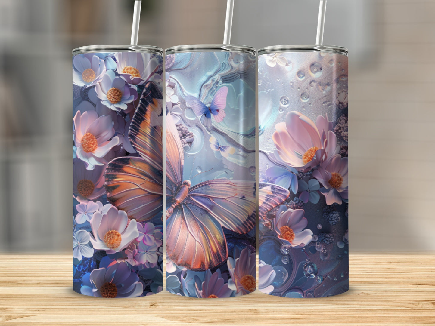 Three tall tumblers with butterfly and floral designs.