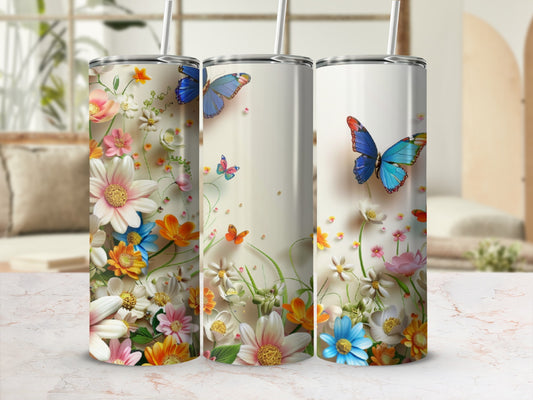 Three tumblers decorated with colorful butterflies and floral patterns.