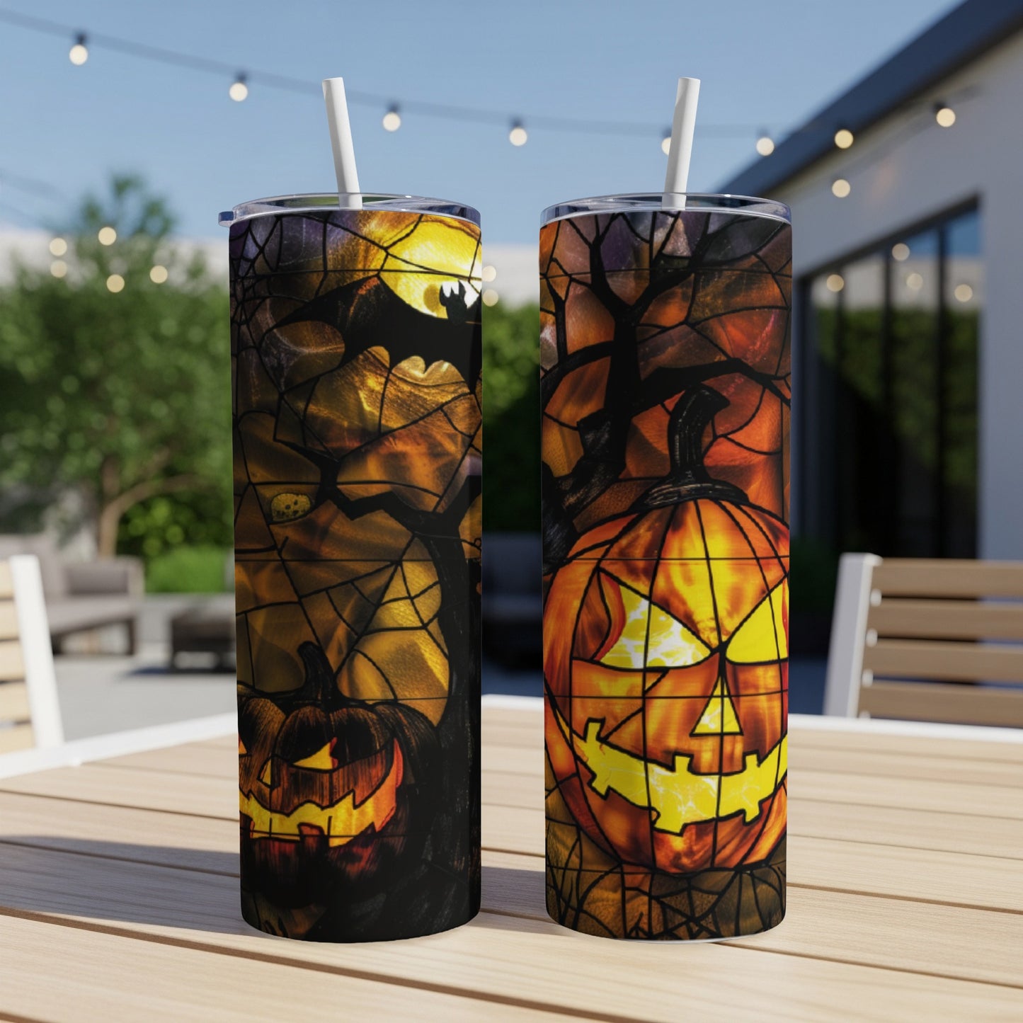 Two Halloween-themed tumblers with jack-o'-lanterns and bat designs.