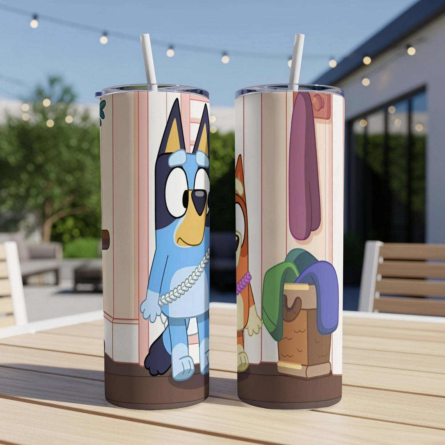 Bluey and Bingo characters on a blue-striped insulated tumbler with a straw.