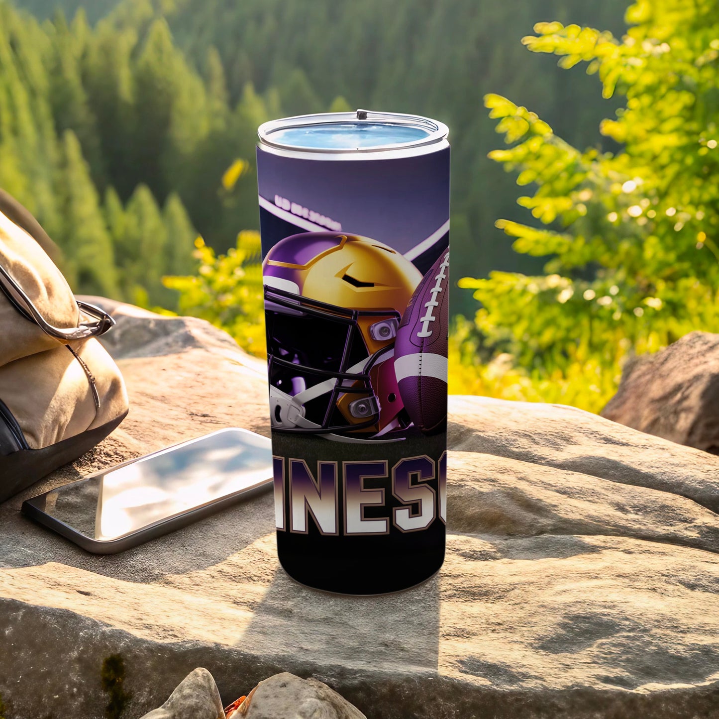 Purple and gold football helmet and ball on a Minnesota tumbler.