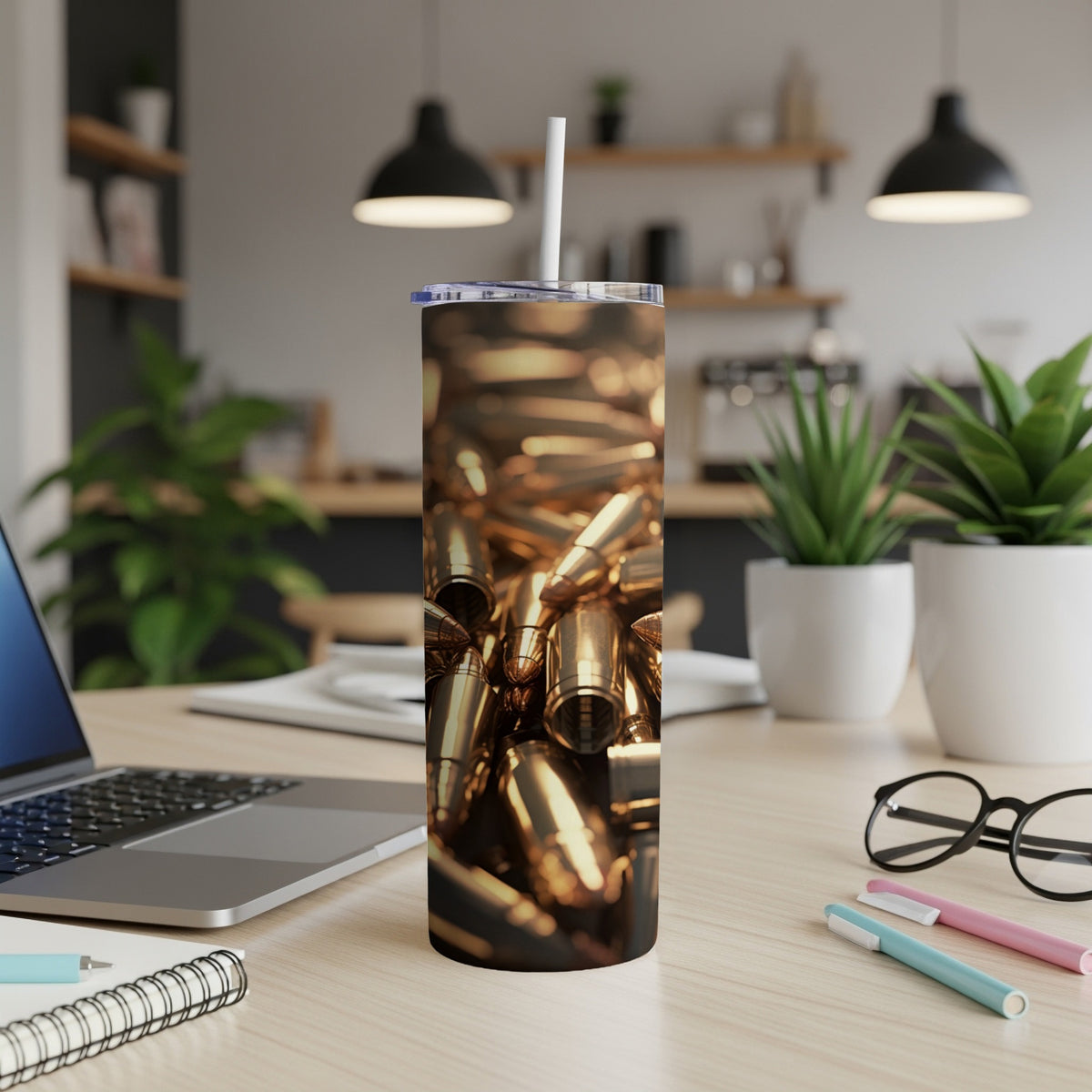 Tumbler featuring a close-up pattern of golden bullets with a white straw.