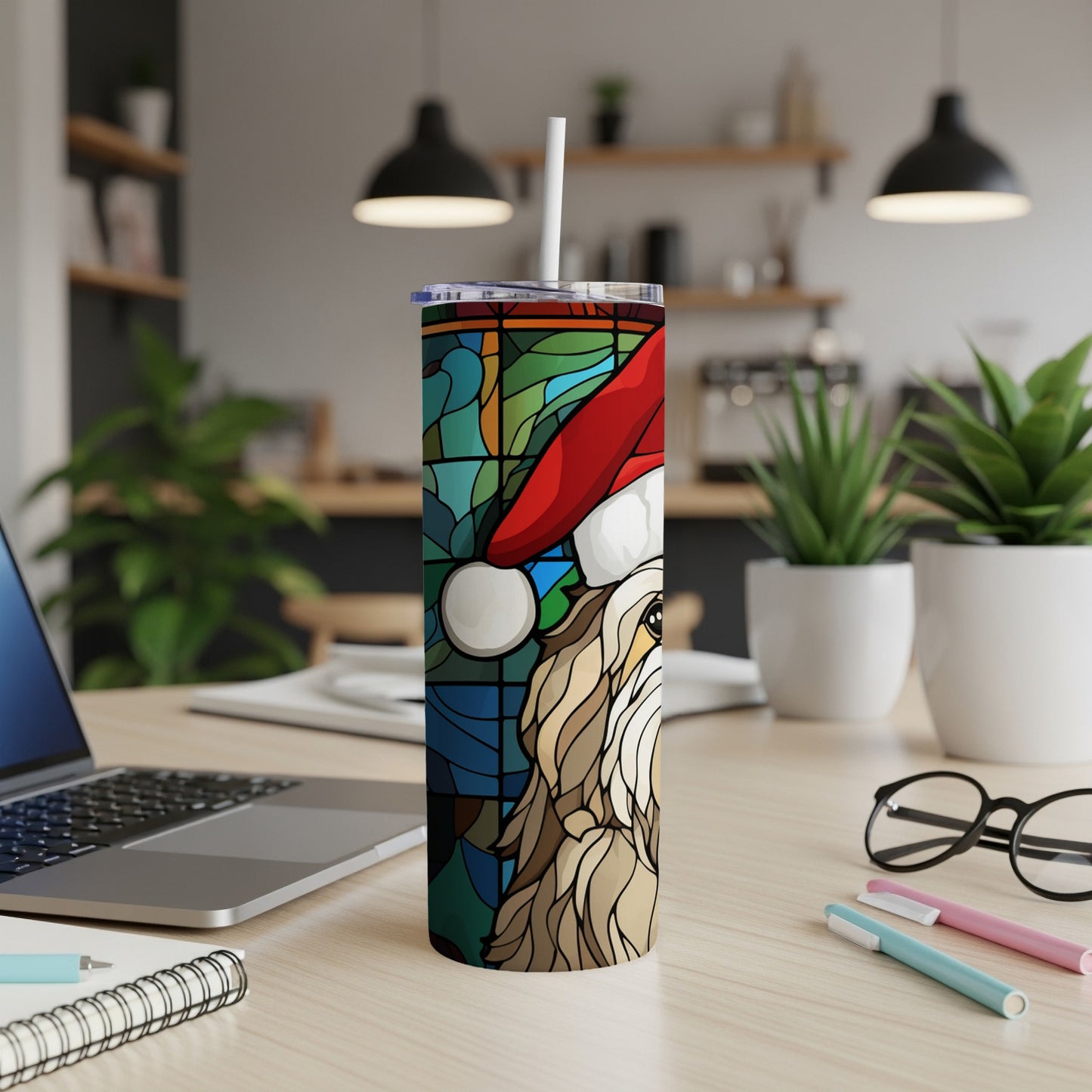 Stained glass dog in Santa hat on a white tumbler with straw.