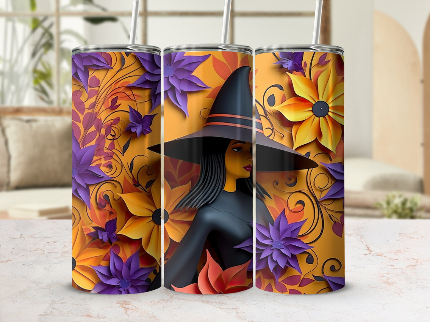 Three tumblers with a witch and floral design in orange, purple, and yellow.
